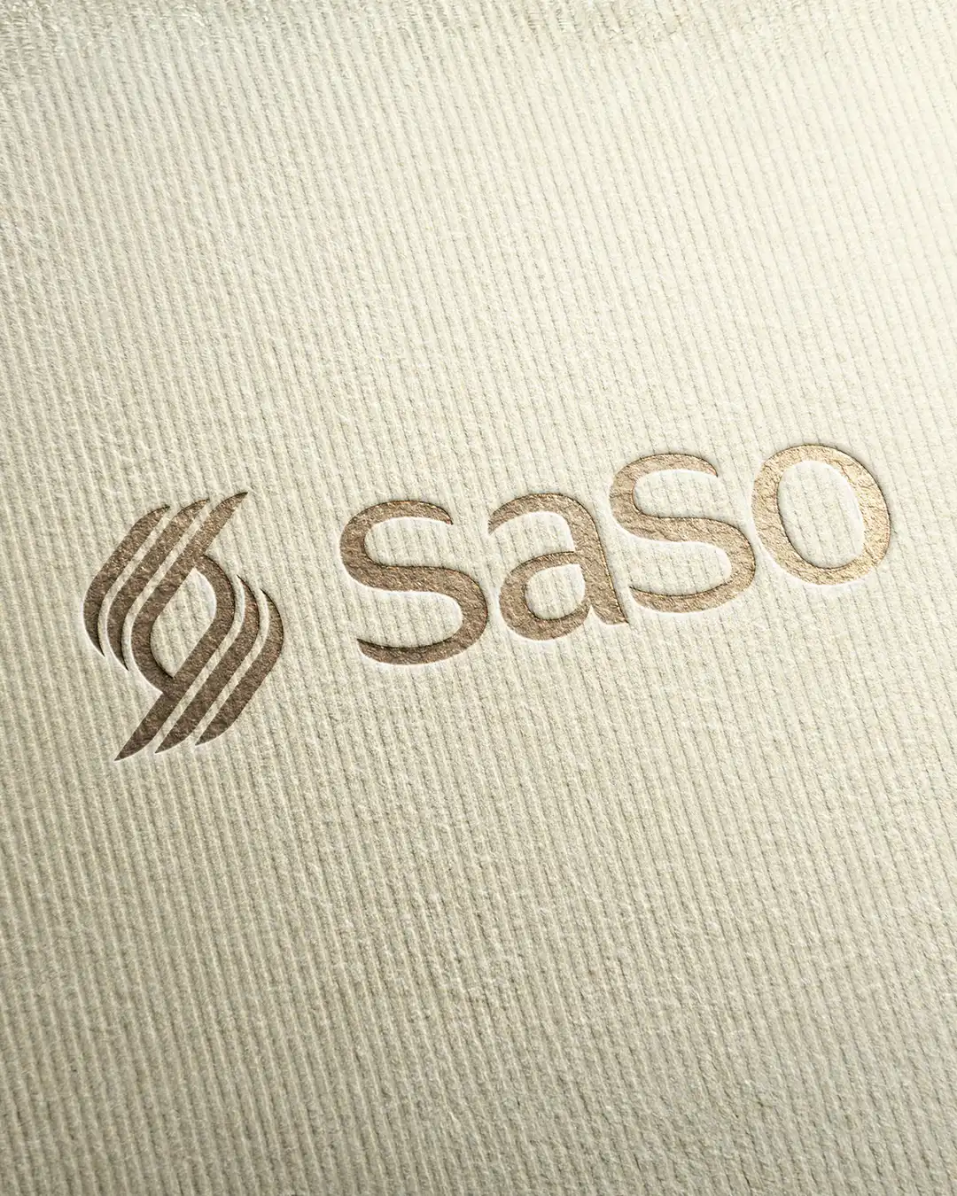 Embossed logo of the word 'saso' next to a stylized abstract design on textured beige paper.