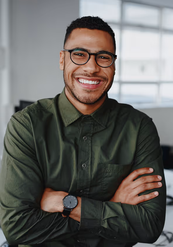 Person smiling at a computer after reducing hand pain with ergonomic changes