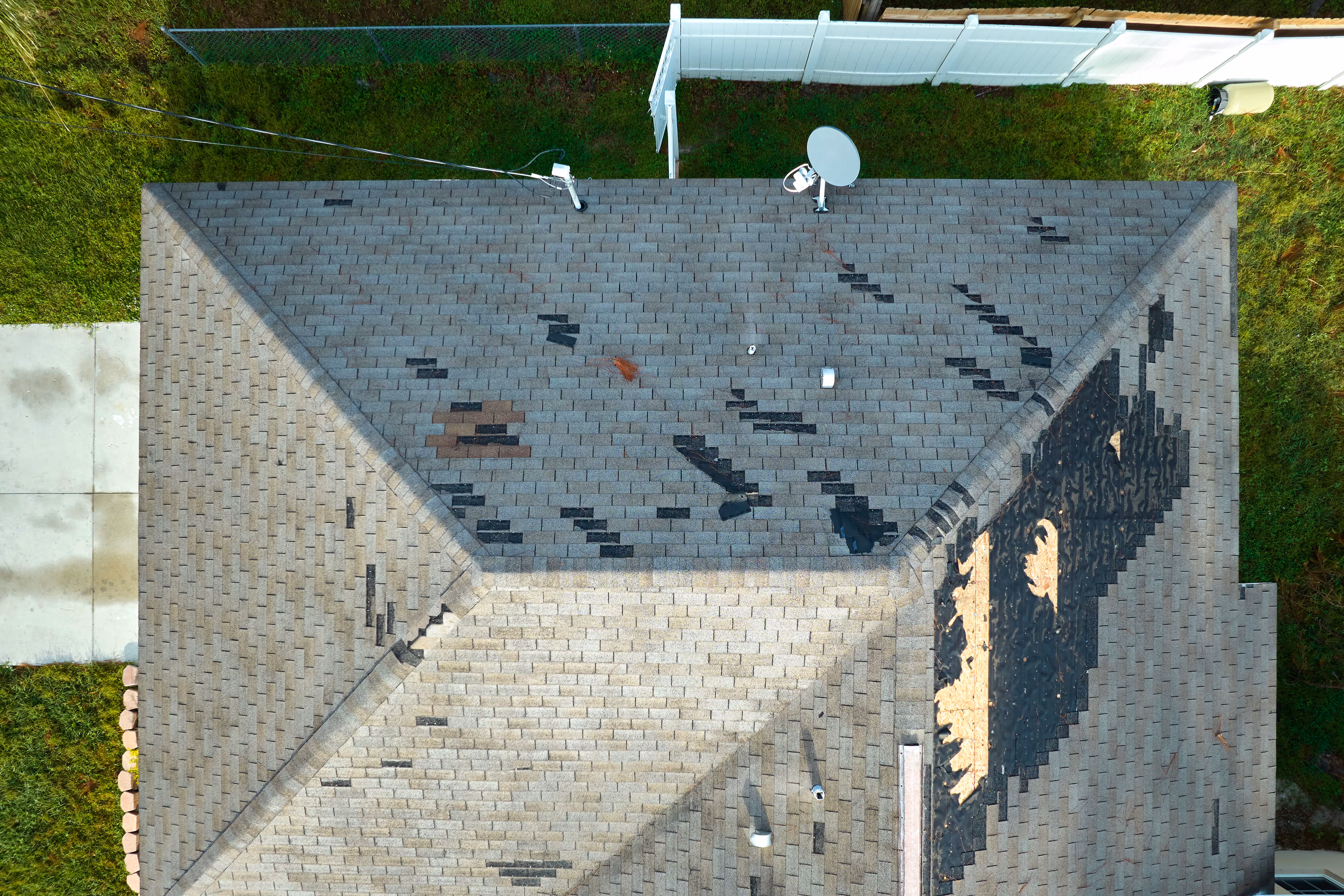 Close-up of hail-damaged roofing shingles identified during a free inspection in Southeastern Wisconsin.