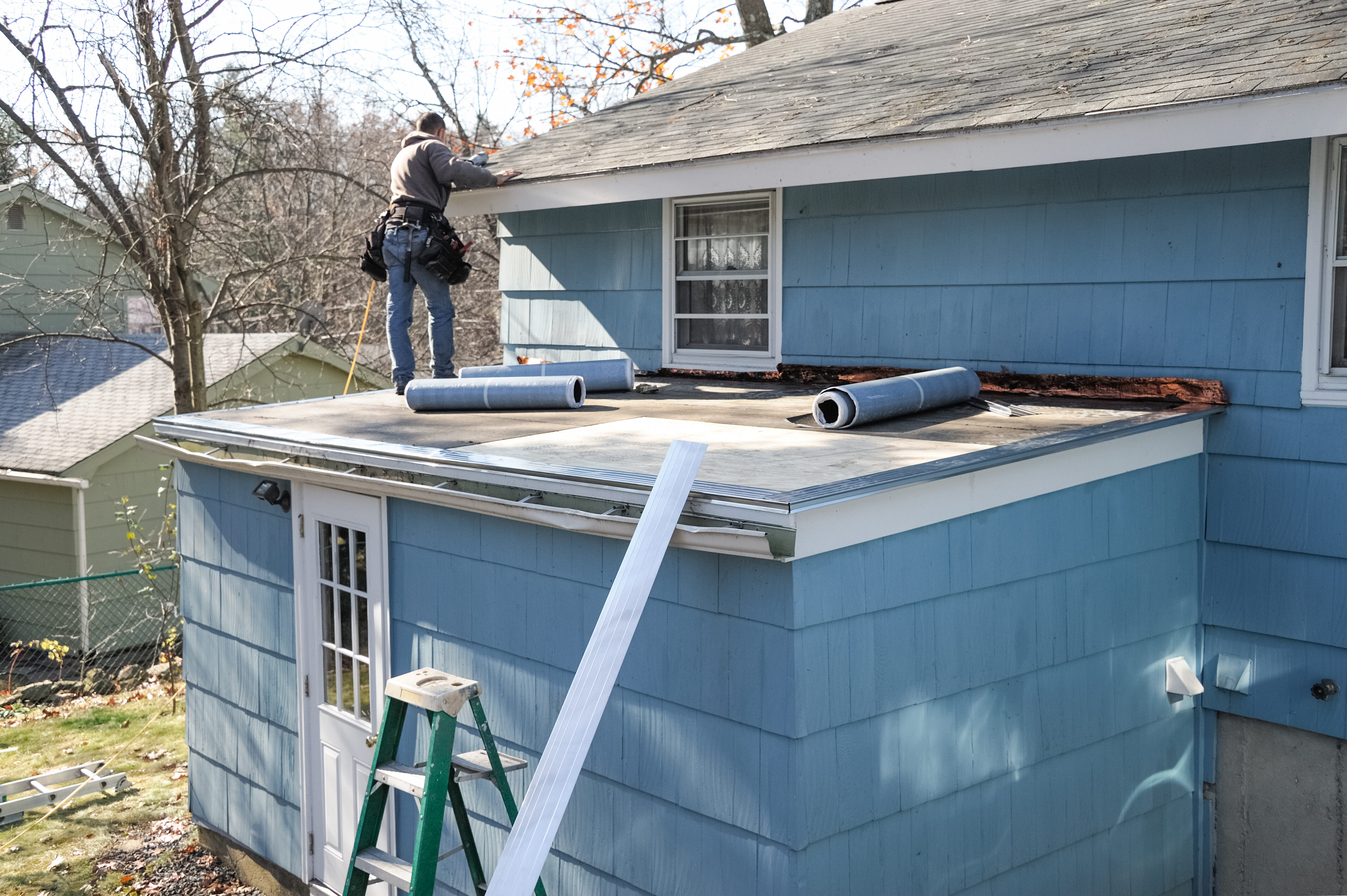 Better View crew custom-fitting seamless aluminum gutters on-site for a residential project.