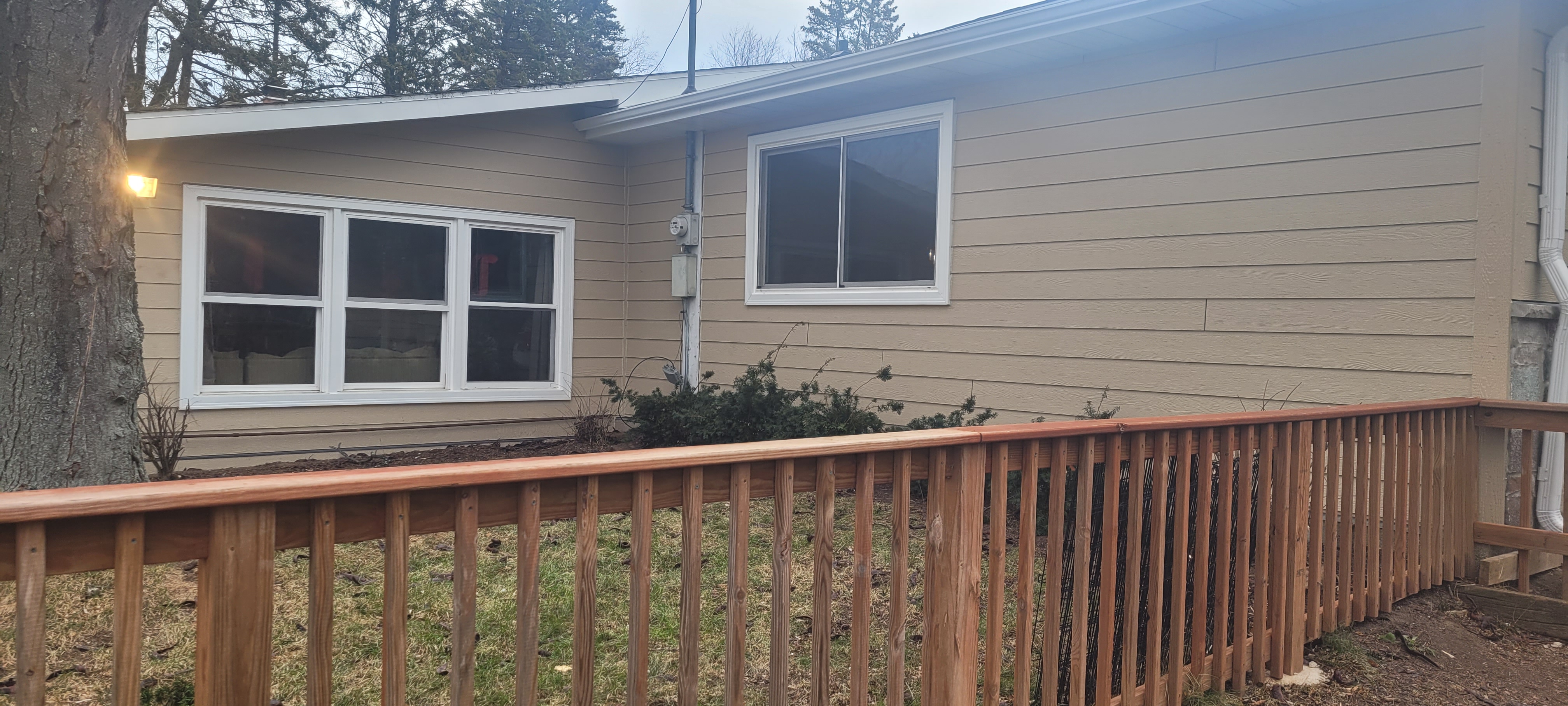 Comprehensive gutter and drainage system protecting a Wisconsin home from basement leaks and erosion.