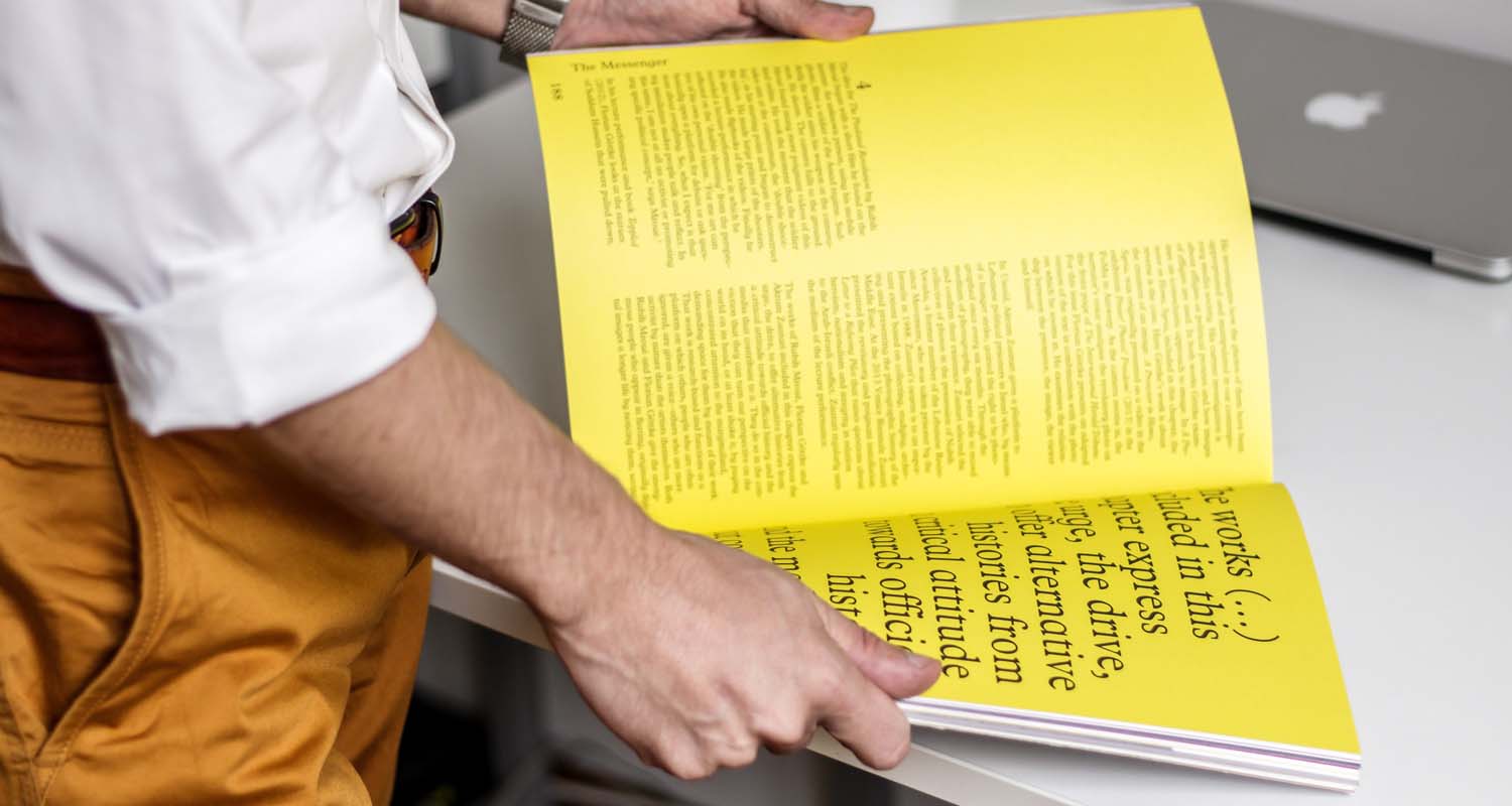 Person reading some print in a book