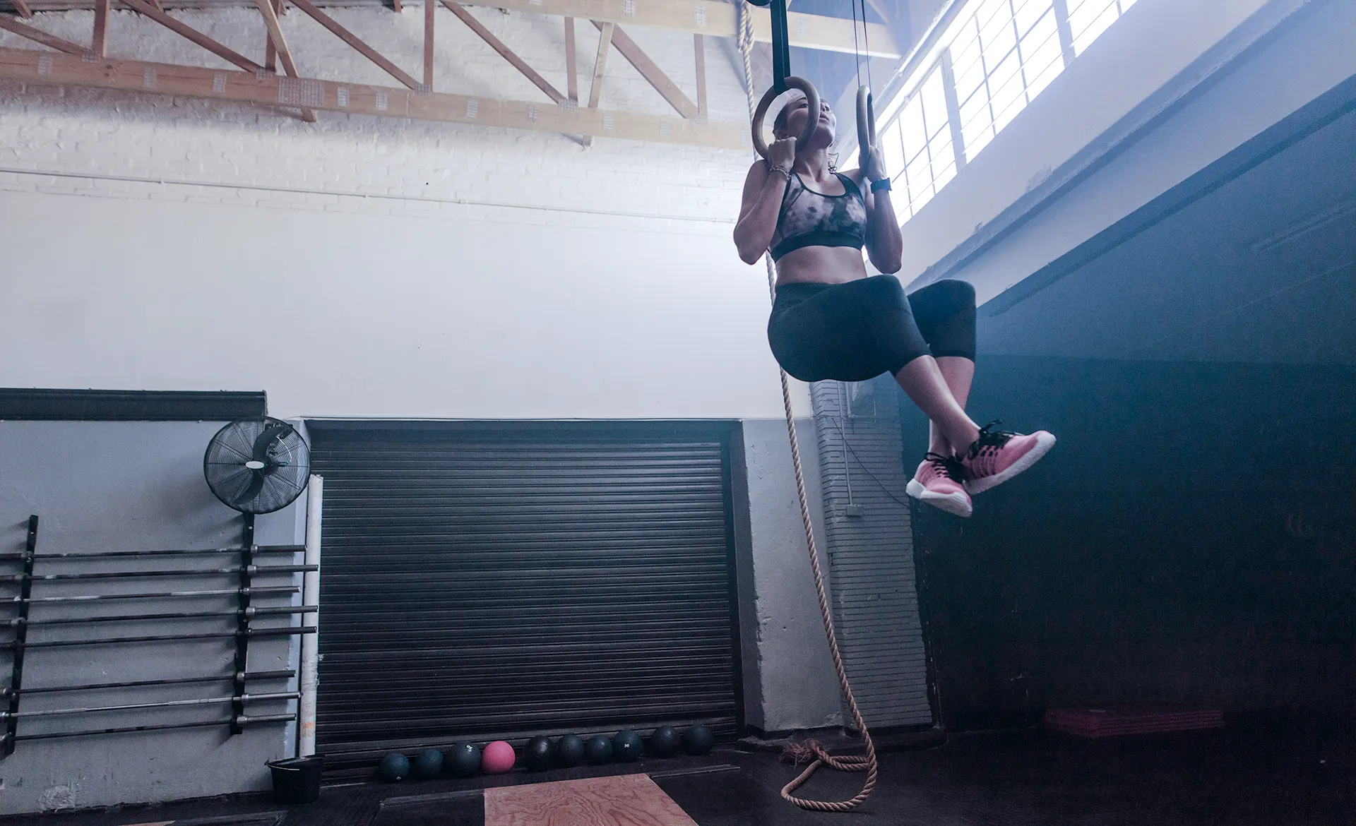 Gym goer achieves a chin-up.