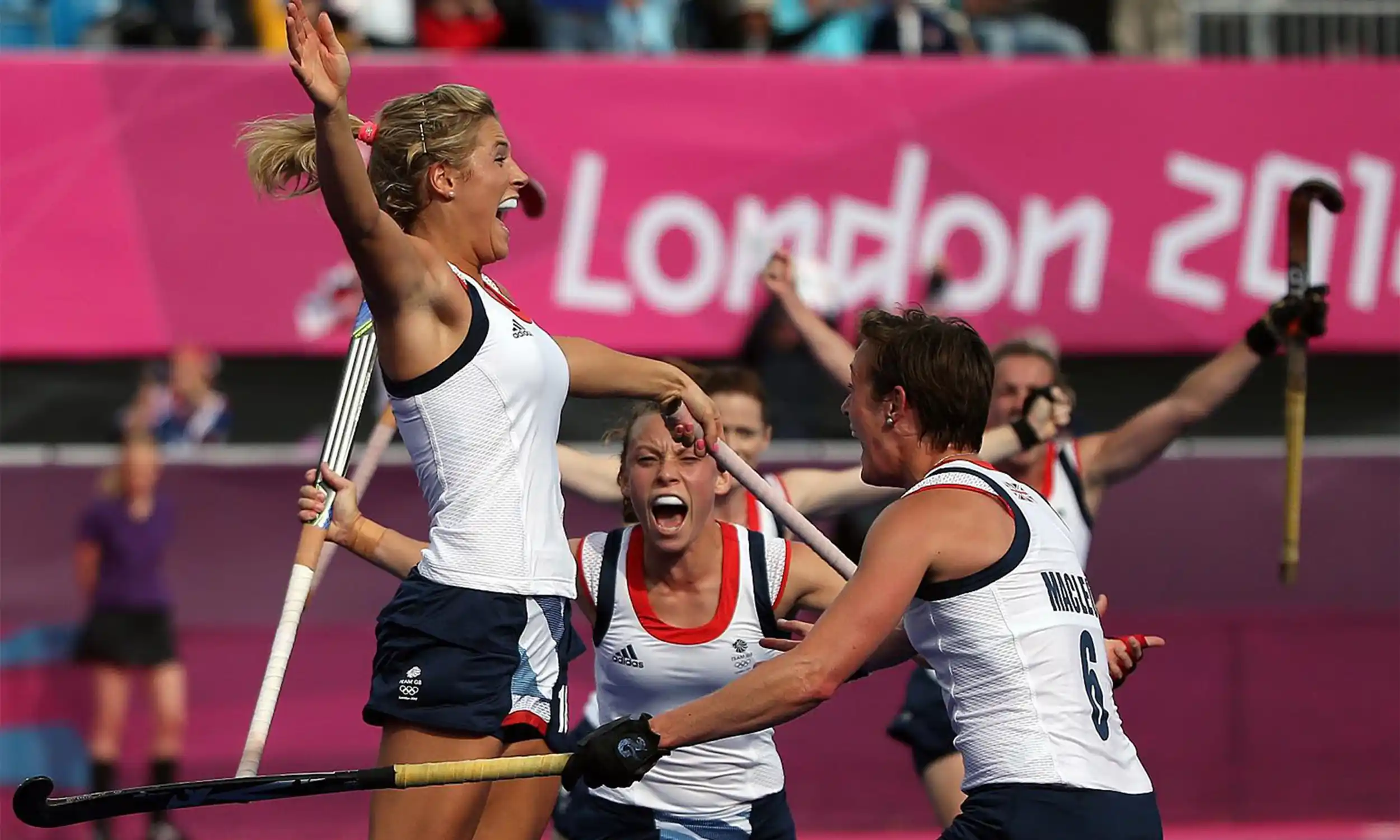 Georgie Twigg celebrating with TeamGB teammates at the London 2012 Olympics