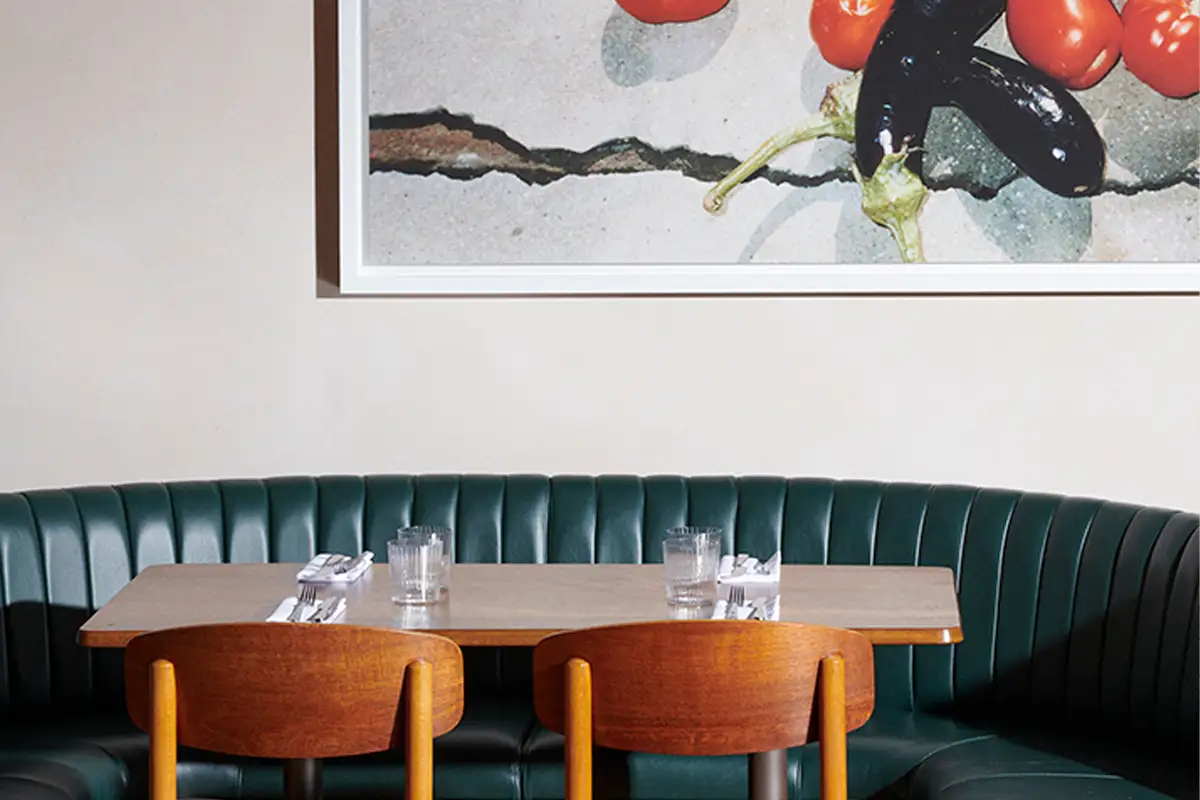 Table and chairs set for service at Toklas restaurant in London