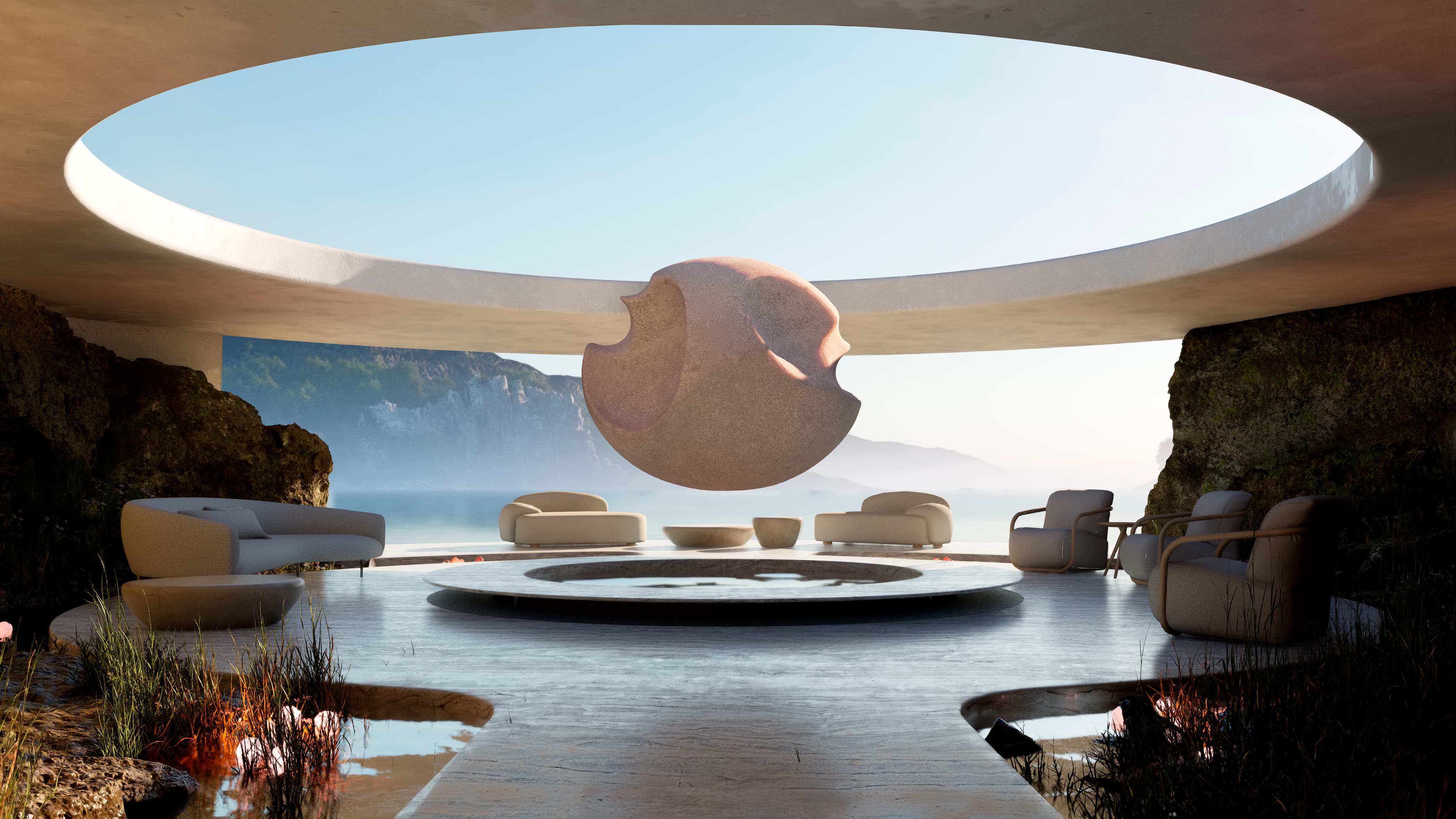 Sala circular al aire libre con una escultura flotante y vistas al mar y montañas.