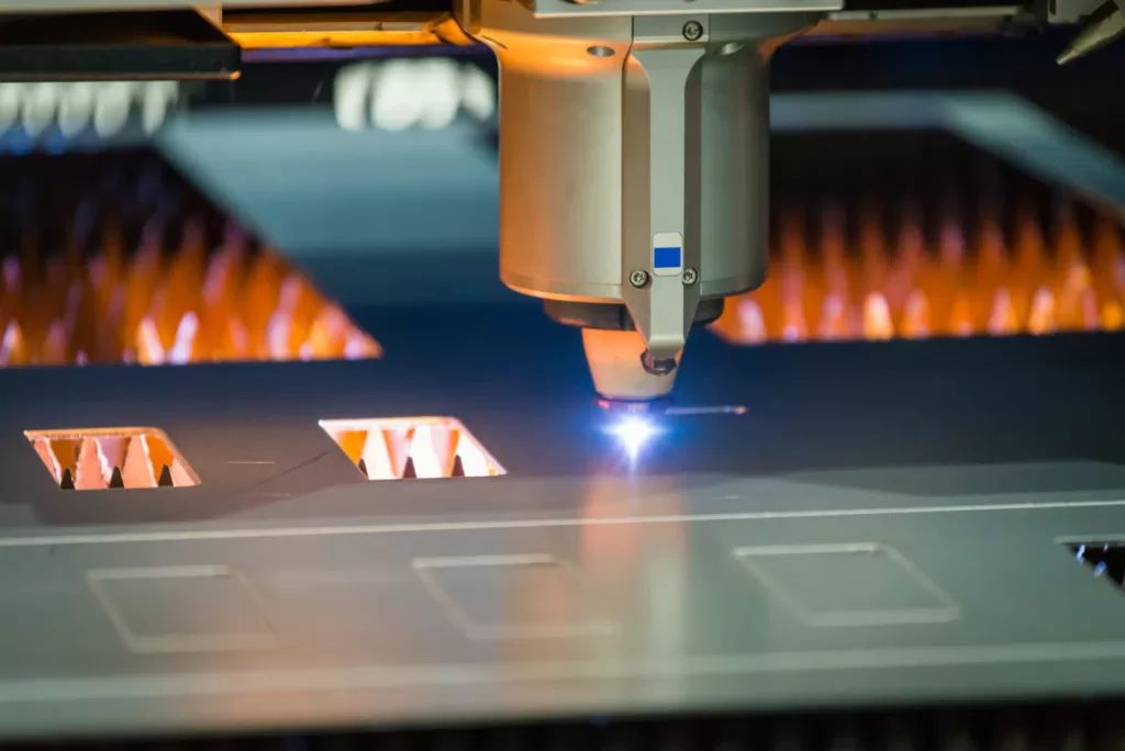 A computer numerical control (CNC) laser cutter quickly and effortlessly cutting metal