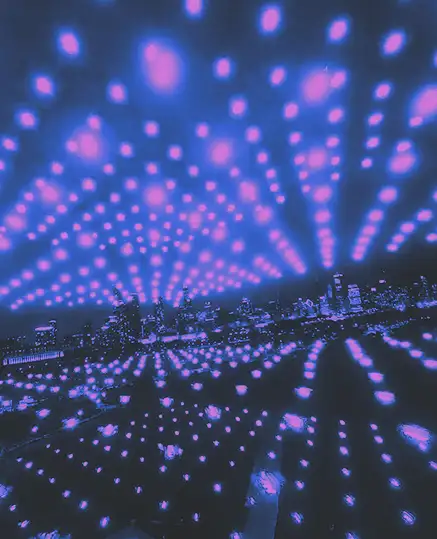 Drones in front of a cityscape.