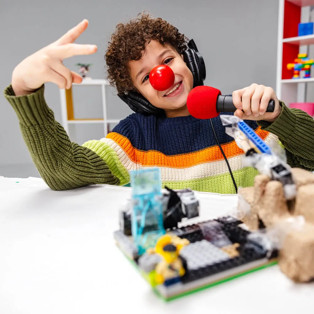 Instruction sheets for a Red Nose Day LEGO community builders challenge with colorful graphics and text.