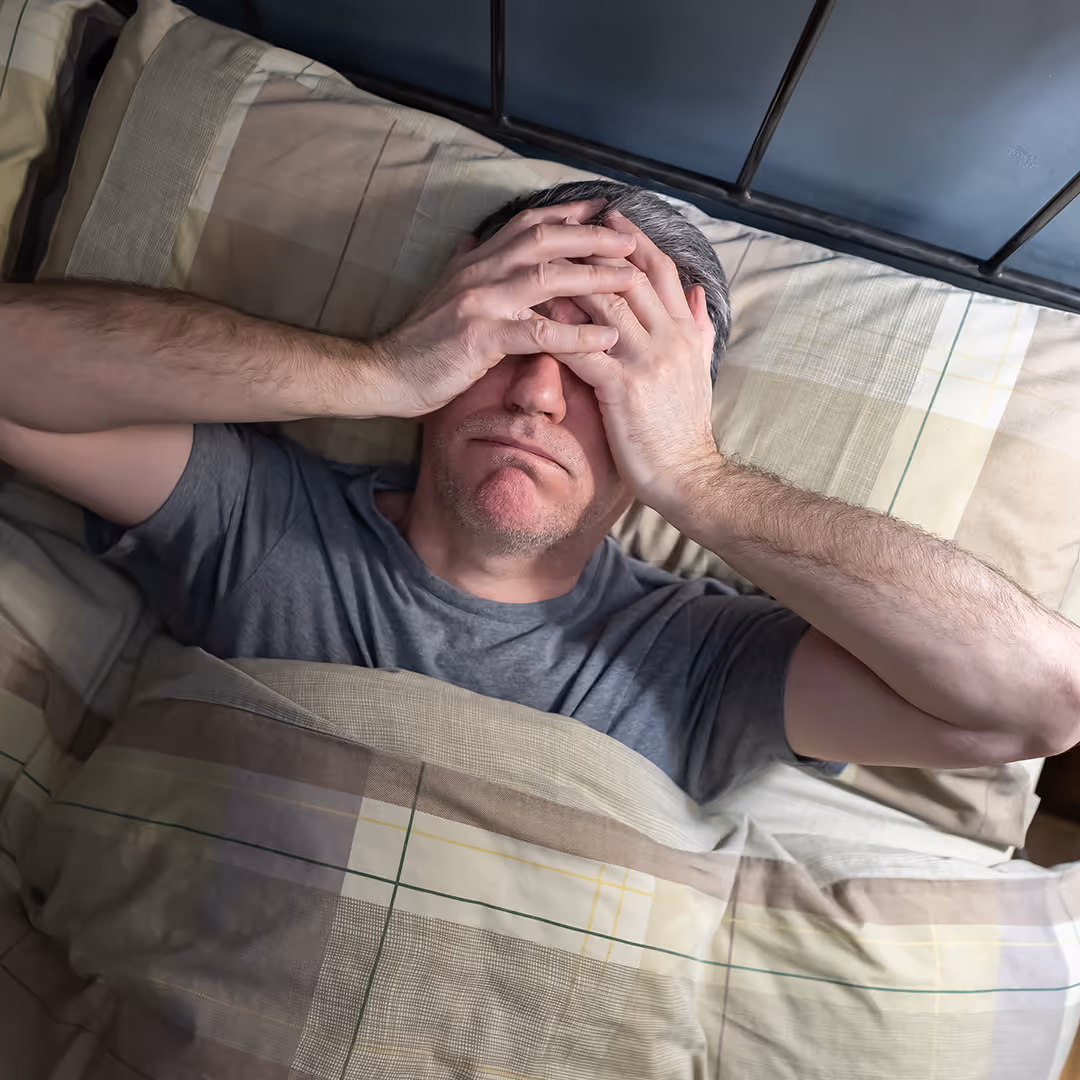 Male laying in bed, paralyzed by anxiety. Anxiety therapy and treatment at Hope Speaks in Richardson TX