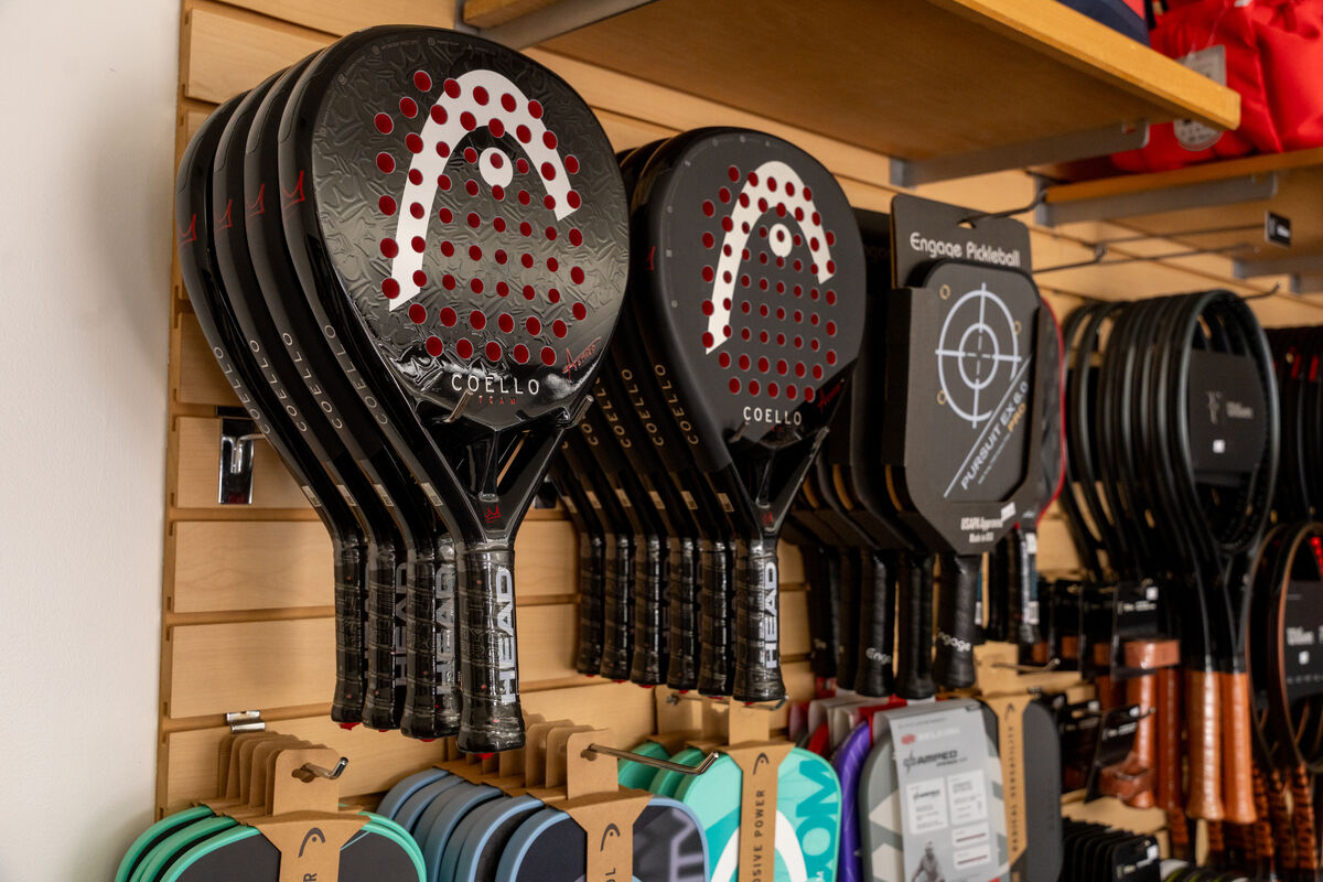 A store display with paddles for Coronado Tennis Pro Shop
