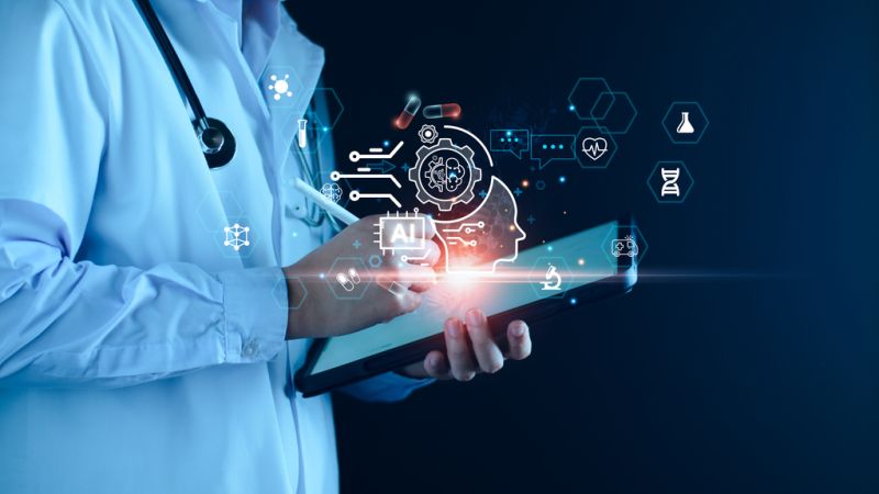 Clinician reviewing virtual medical scribe documentation and AI-generated clinical notes on a laptop