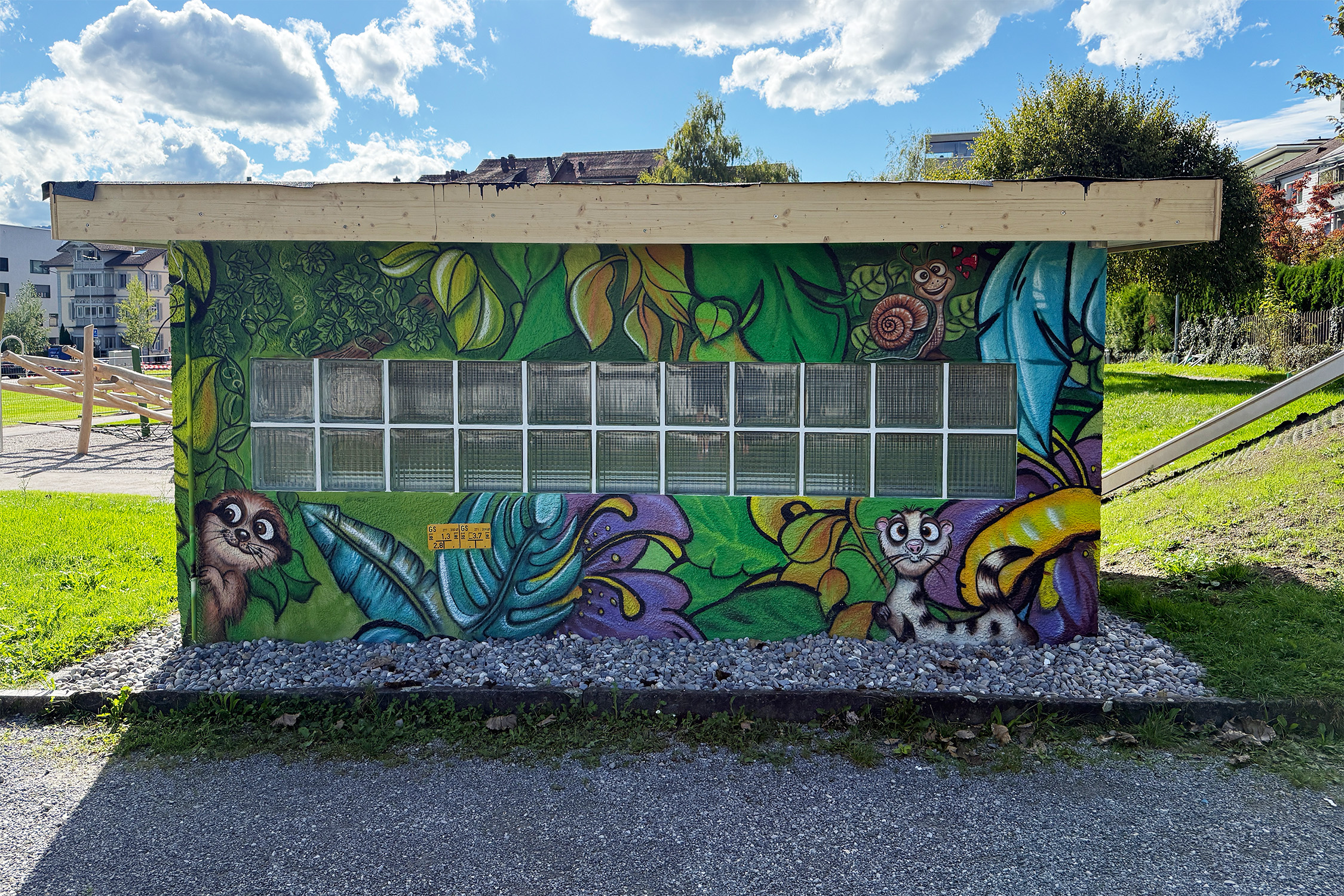 Lush green jungle scene framing glass blocks with friendly animals and foliage; textured spray technique on rough render.
