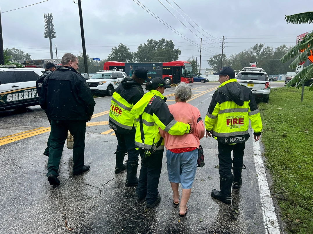 Osceola Fire Fighters assist and elderly community member