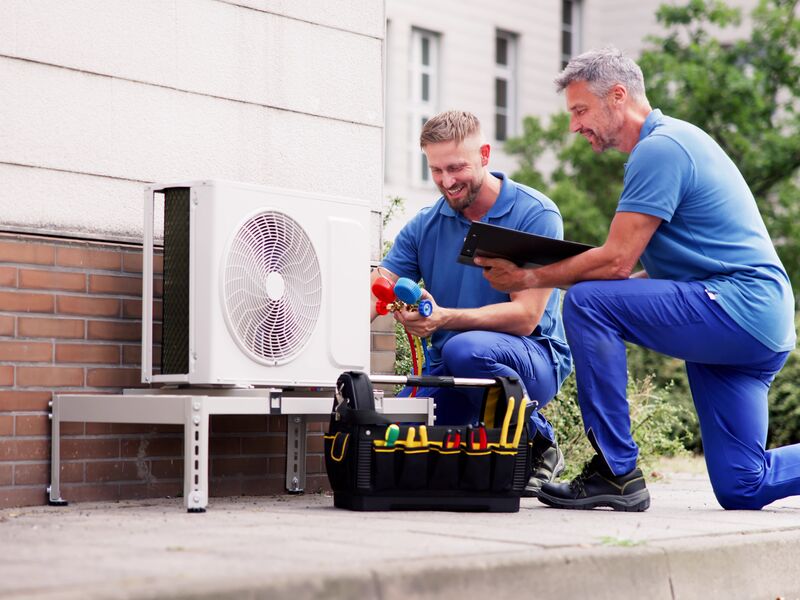AC lifespan. technician inspecting HVAC system for long-term performance in Ponte Vedra, Florida