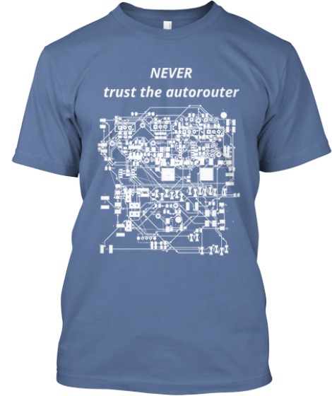 Denim-blue engineer t-shirt that reads "Never trust the autorouter" above a white PCB circuit diagram.