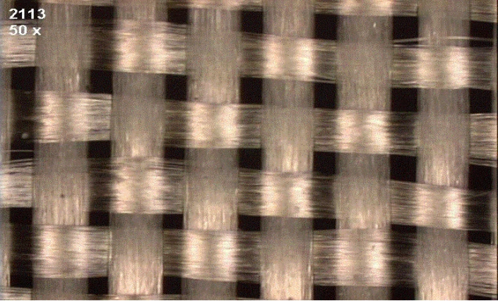 Micrograph of 2113 glass weave fabric showing glass bundles of uneven width and irregular spacing between them.