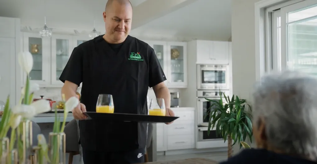 Caregiver brining plate to his patients