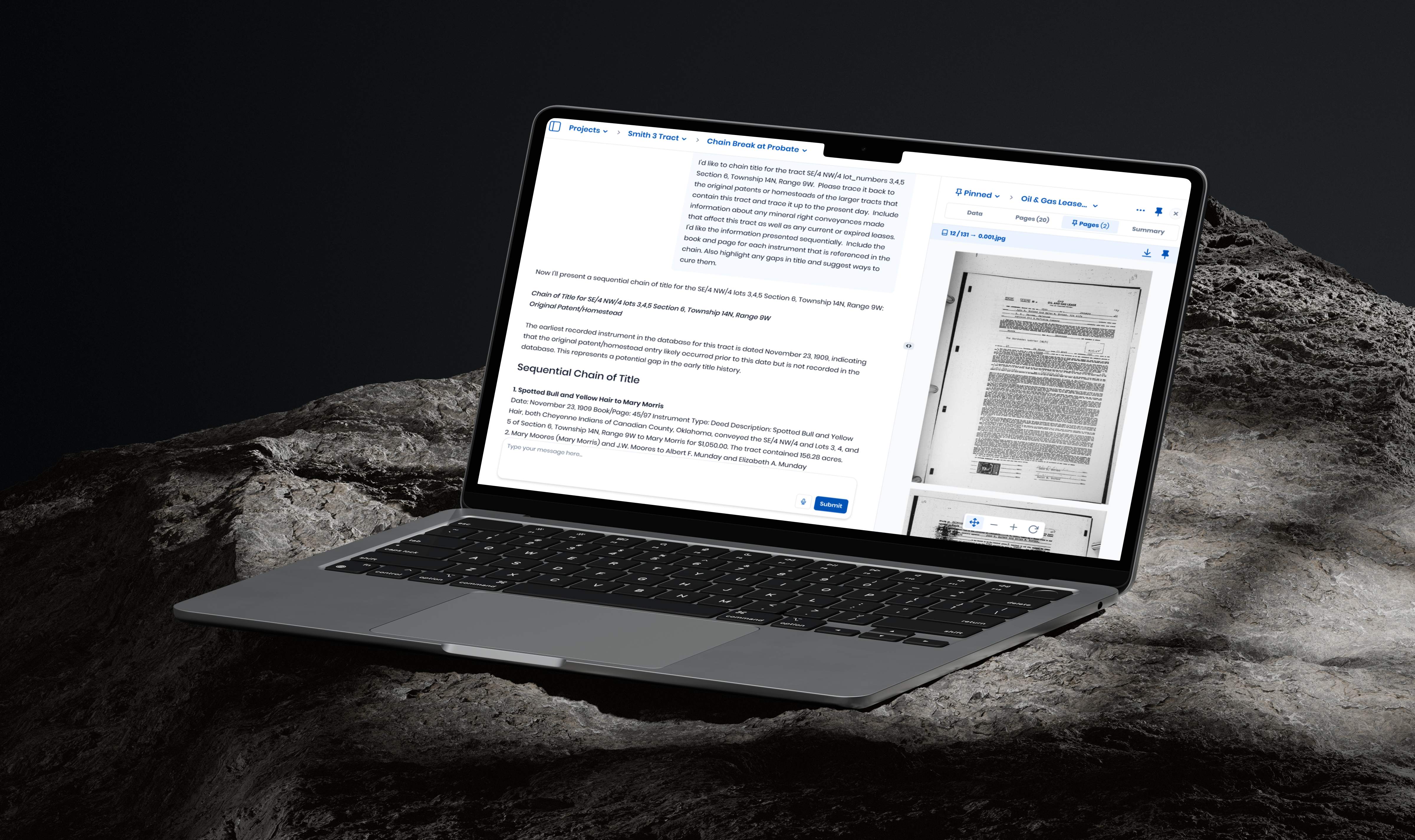 Laptop displaying project documentation with scanned pages on rocky surface background