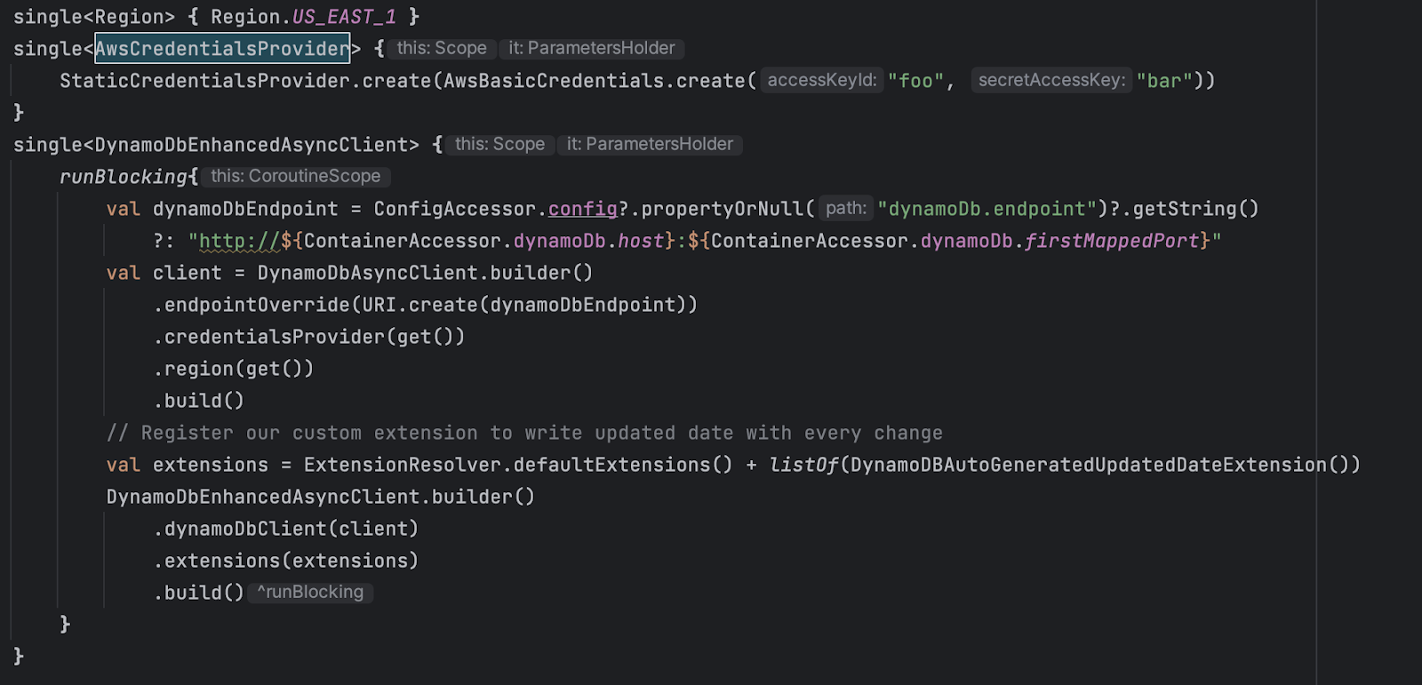 Kotlin code showing AWS DynamoDB async client configuration with credentials and region setup