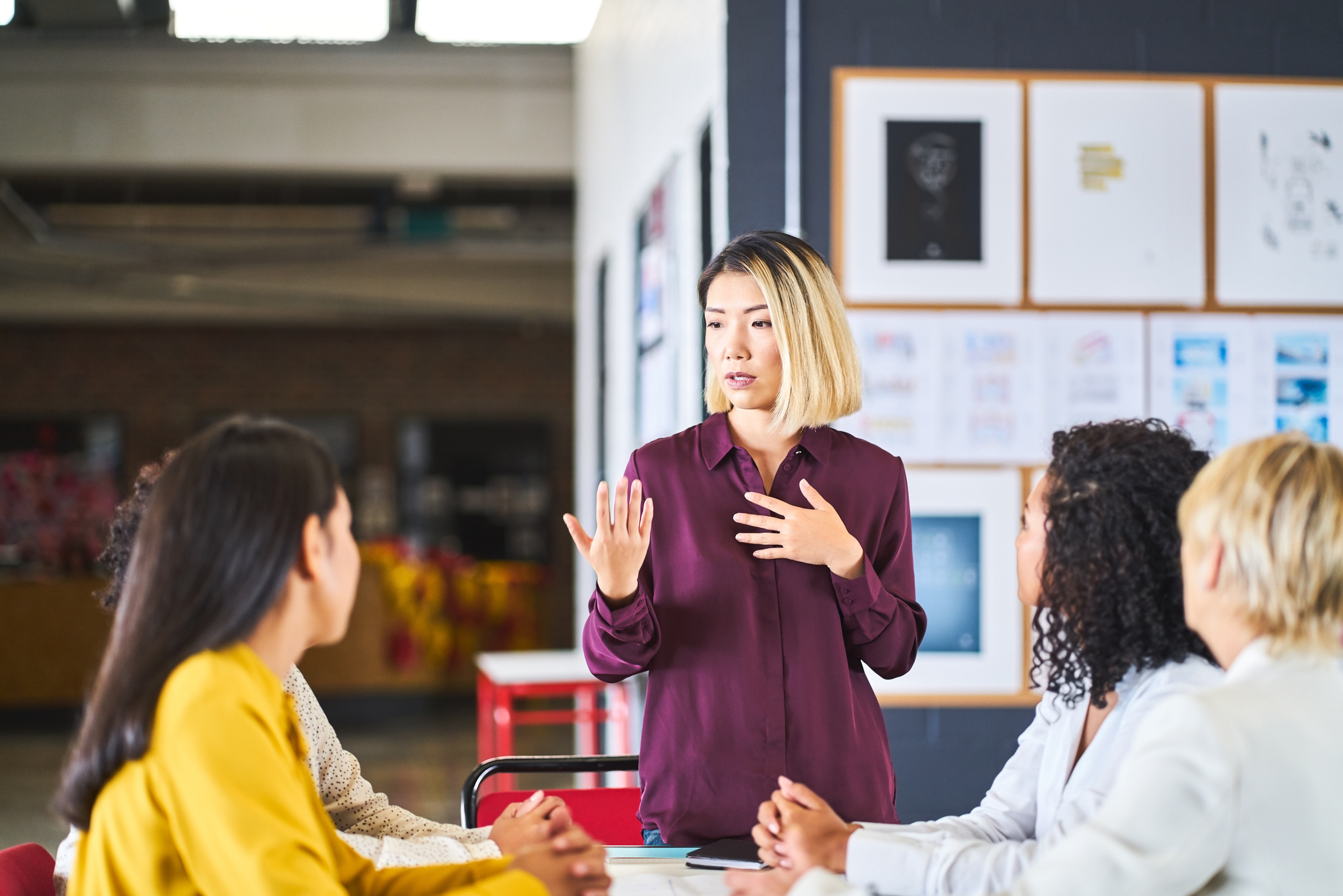 Woman in an office leading a brand strategy workshop 