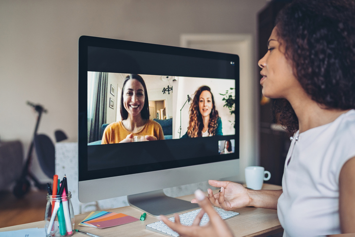 Female employee on a Zoom call with two other team members