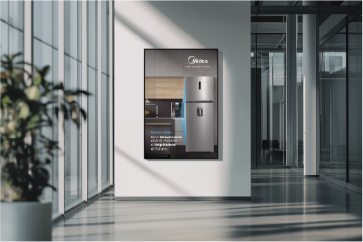 Modern office hallway with large windows and a framed poster of a stainless steel refrigerator on a white wall.