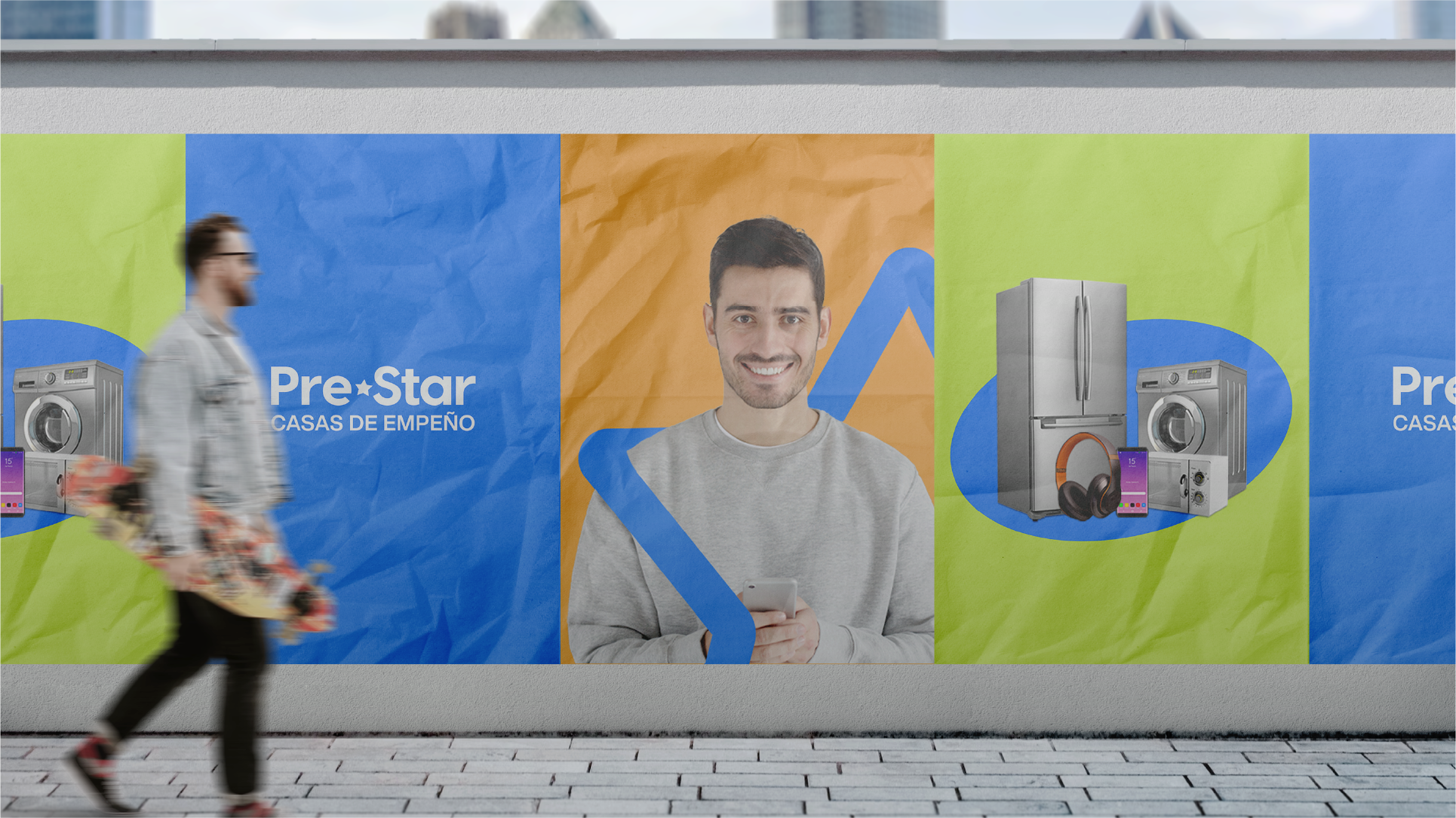 Outdoor advertisement with a smiling man holding a phone, surrounded by images of appliances and electronics on colorful panels, a blurred man carrying a skateboard walks by.
