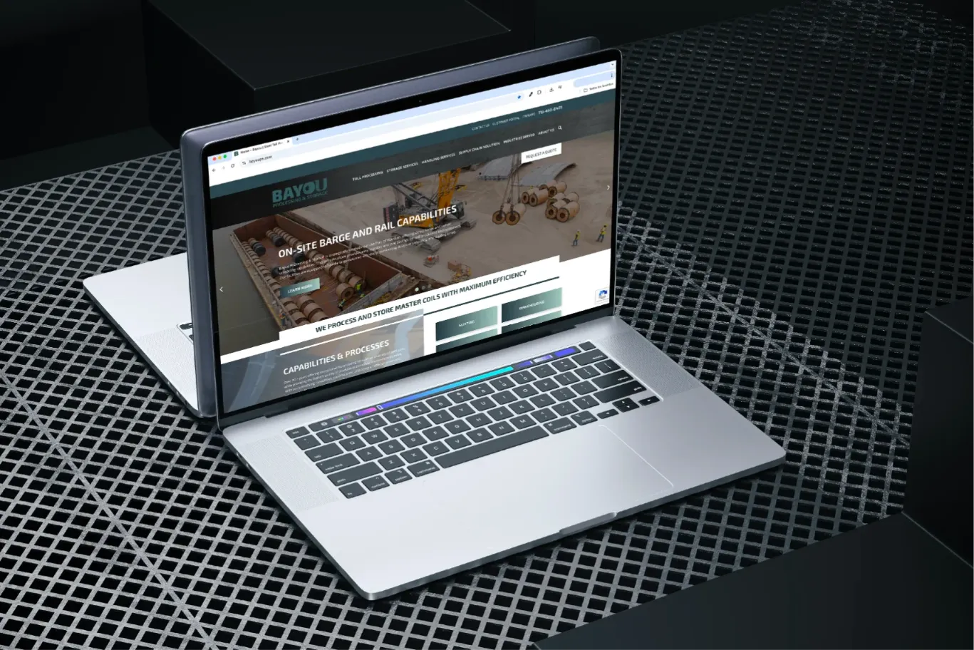 Laptop displaying a real estate website with a tall building and text in Spanish about elevating your life.