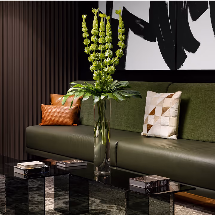 lounge seating with leather couch and art in background