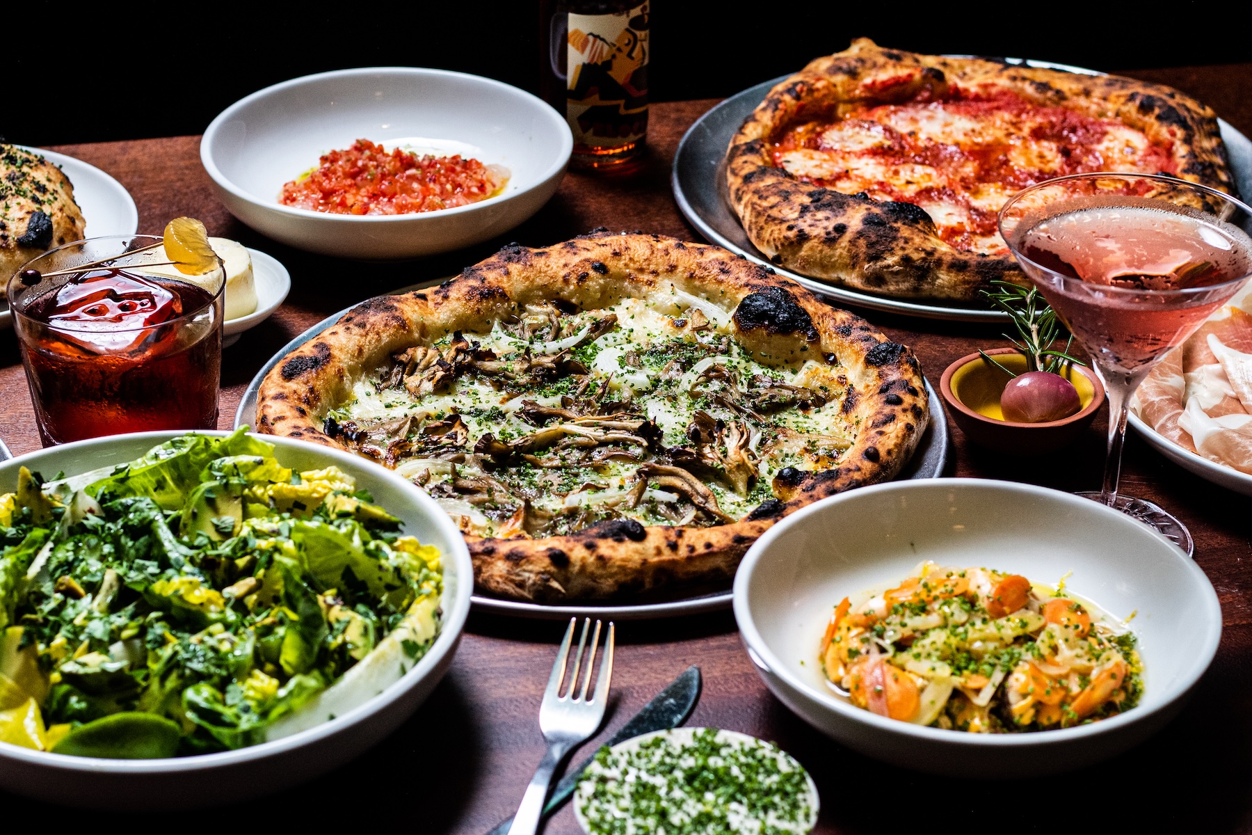 delicious italian food laid on wooden table