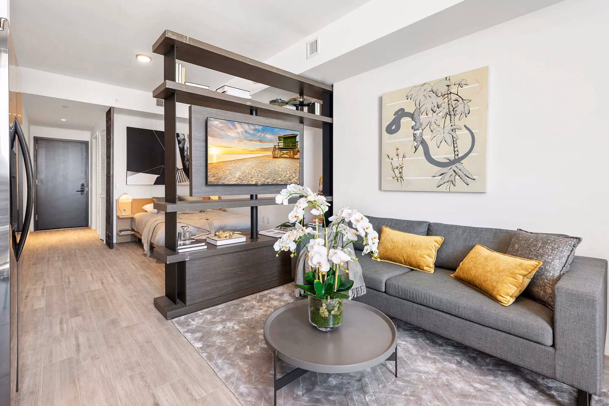 layout of hotel room with seating and bed
