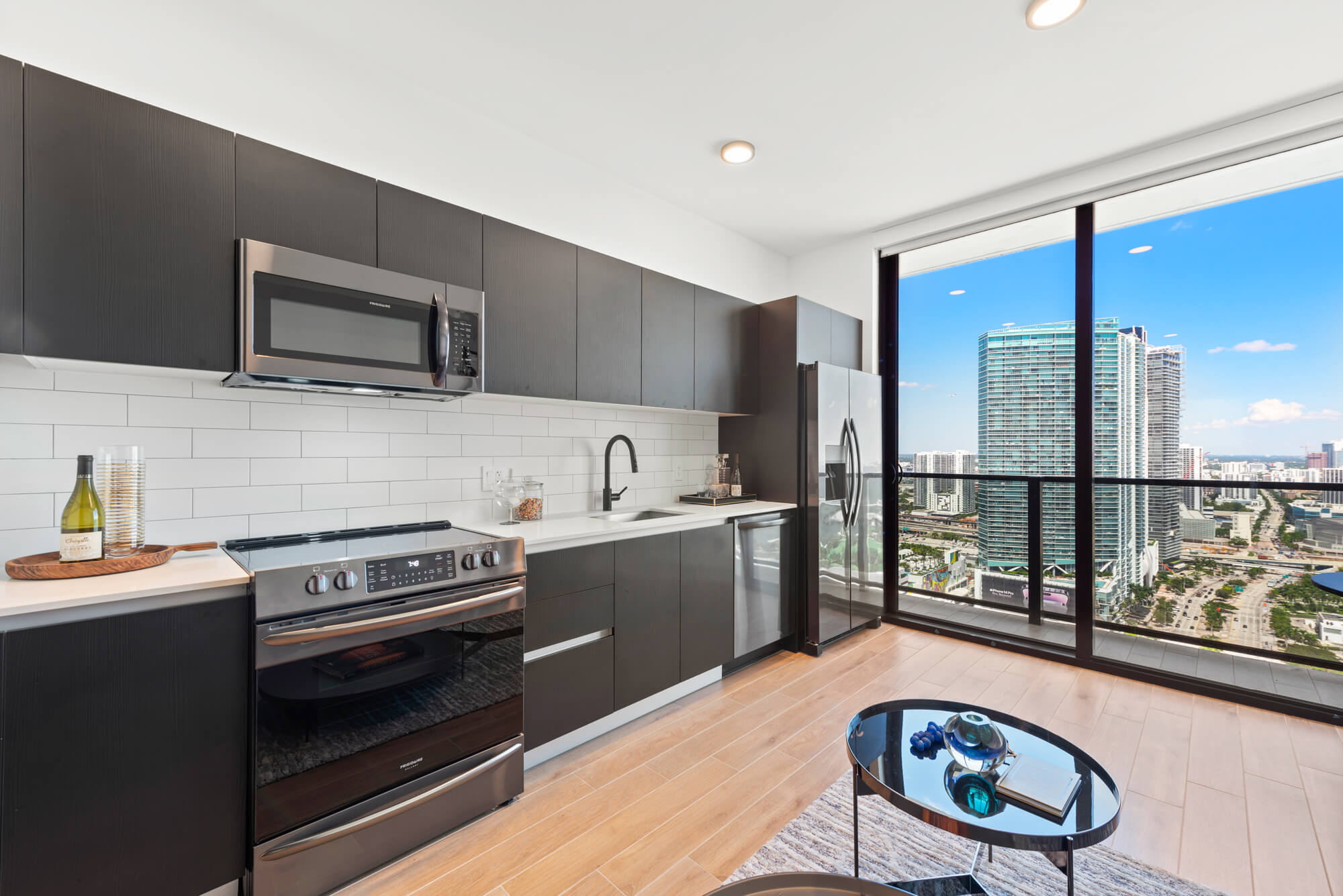 high end residential kitchen with view of miami