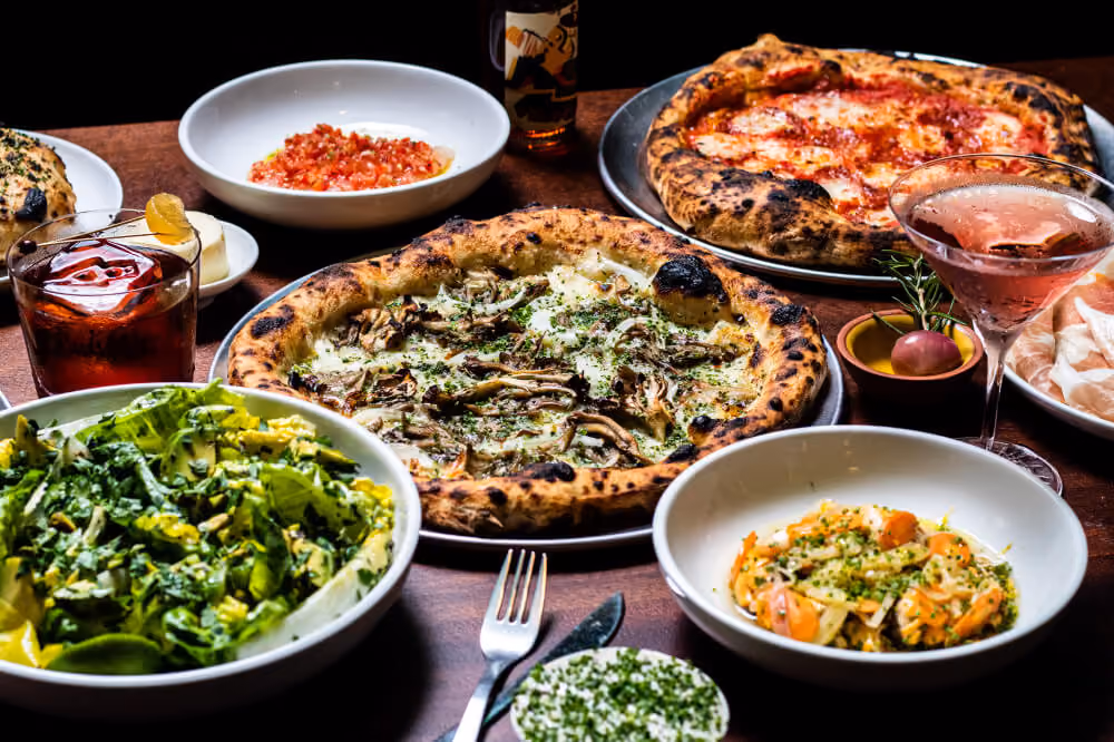 pizza pastas and food laid out on table of vice versa