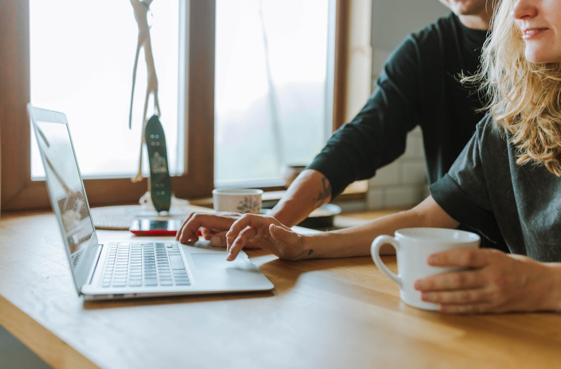 Woman Verifying Email with a Colleague