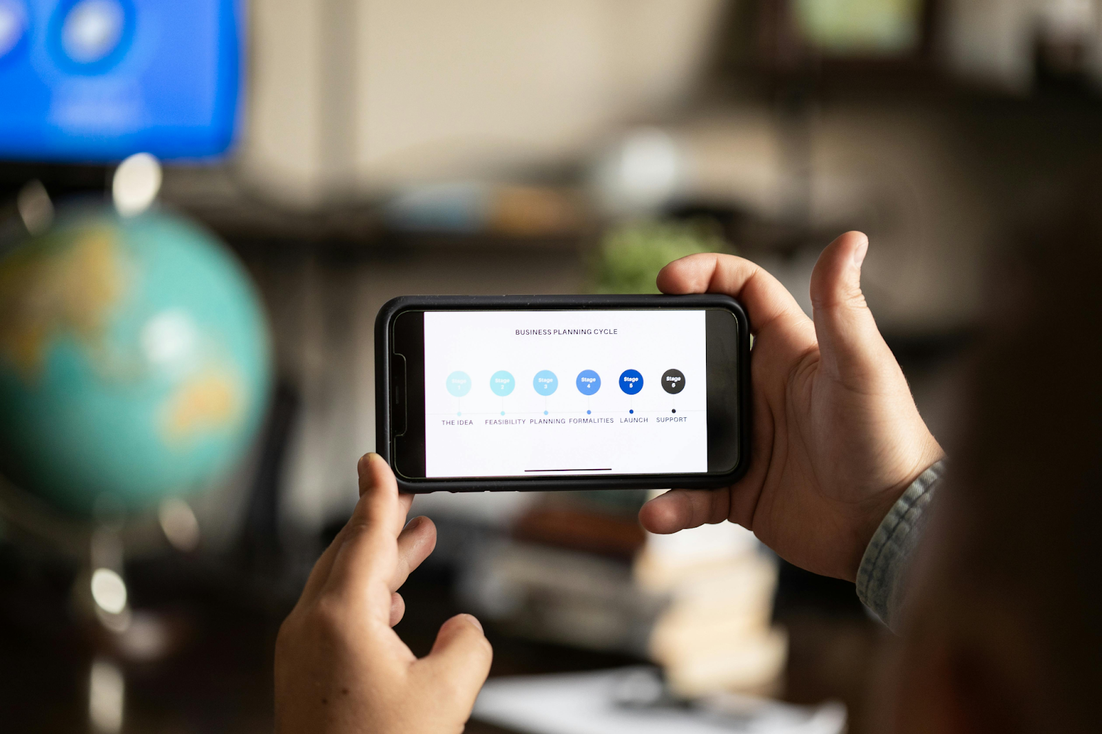 a person holding a mobile phone