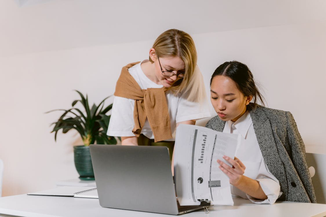 women looking at the documents