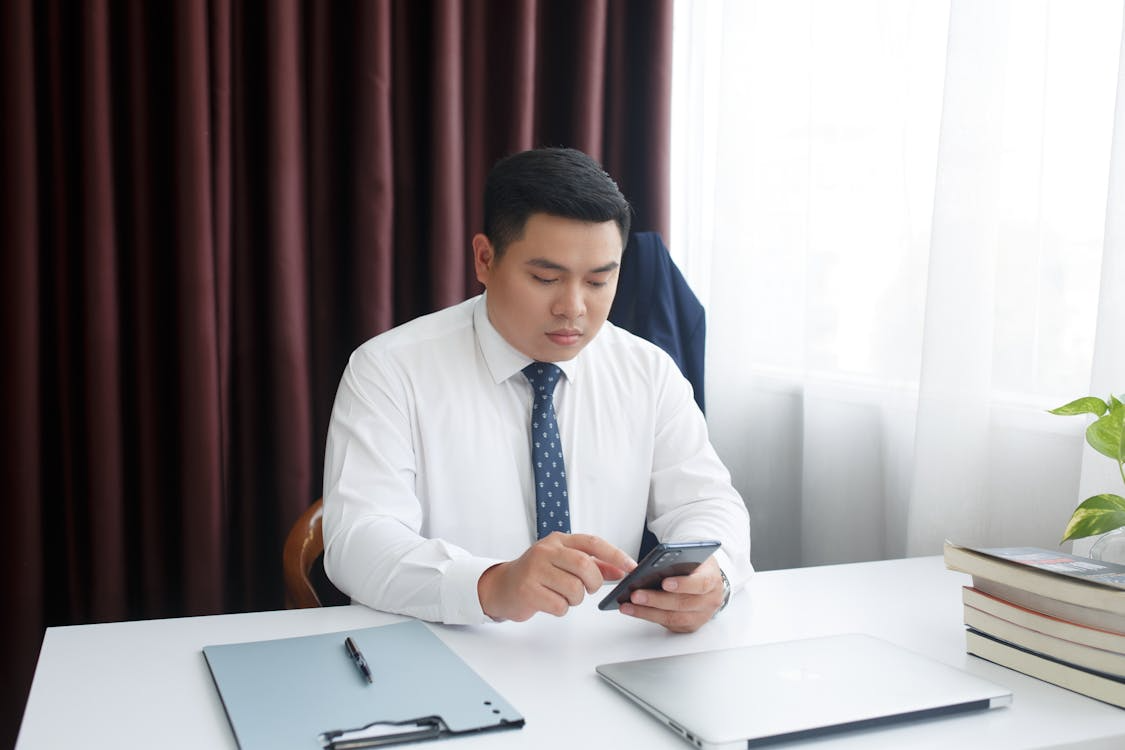 An employee completing a short cybersecurity microlearning lesson on a mobile device, illustrating the bite-sized training approach