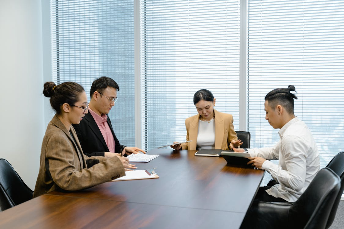 Business executives reviewing a cybersecurity incident report together in a conference room