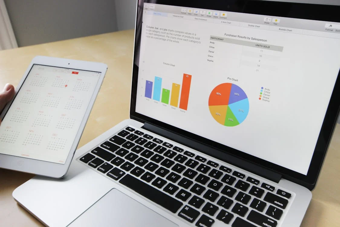 Laptop displaying data charts and graphs