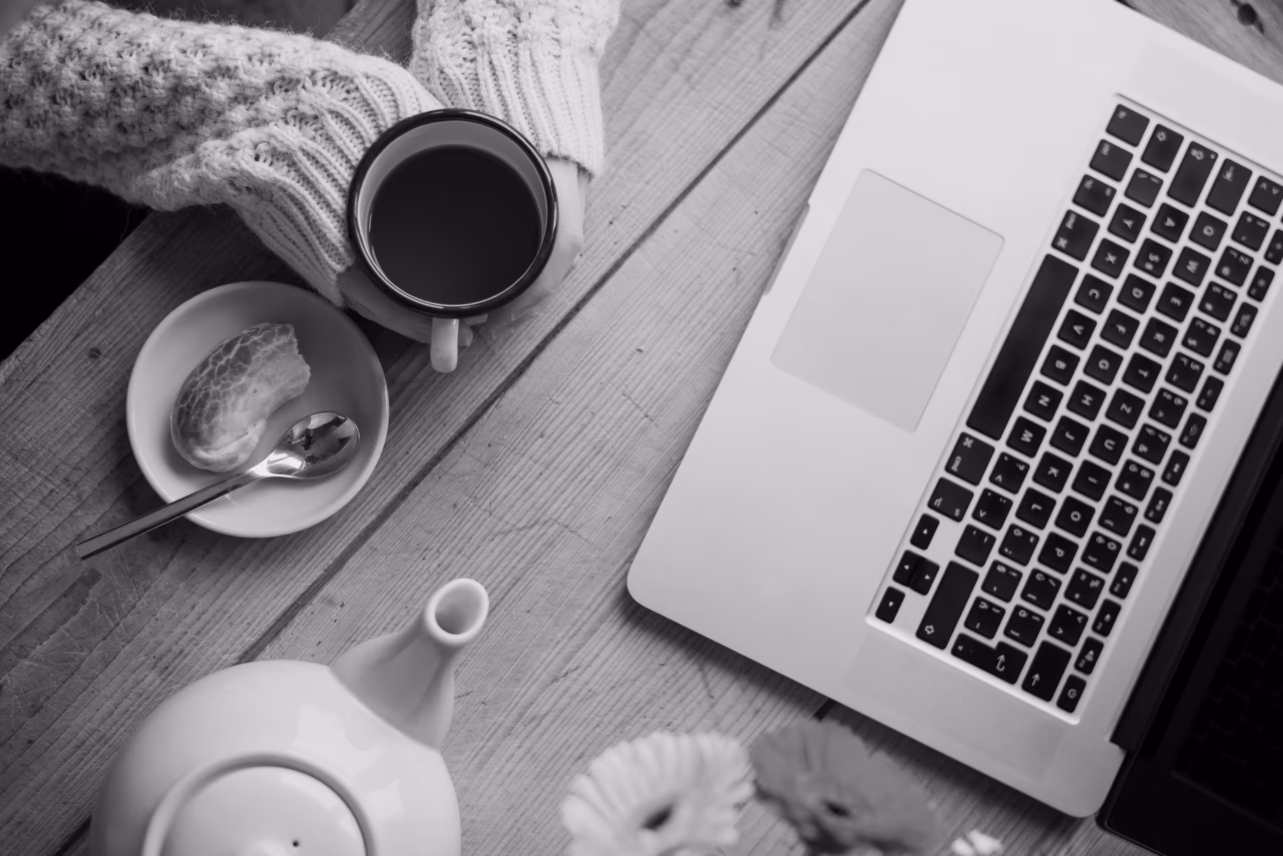 Overhead shot of adult with tea and laptop, having a first online therapy session|