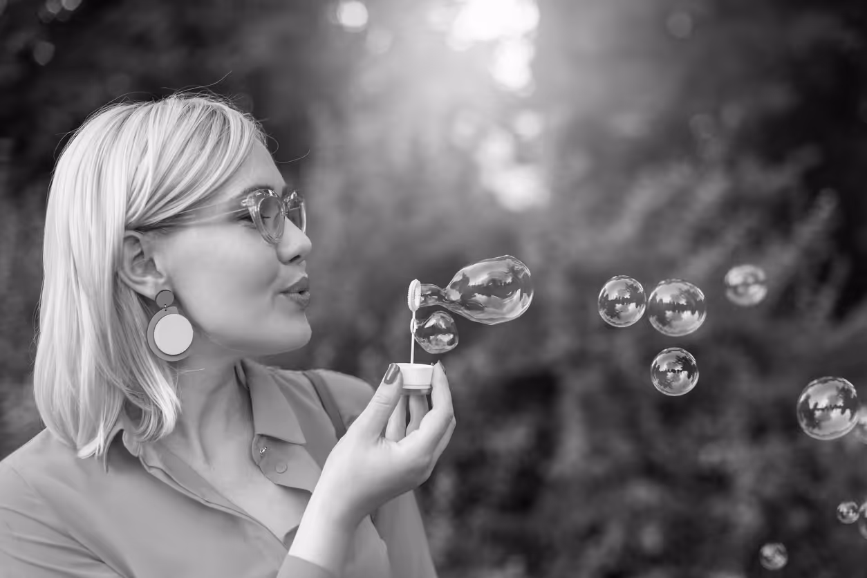 Person blowing bubbles