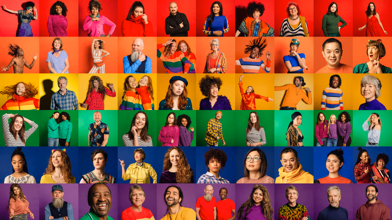 A montage of a large group of individual portraits together to form a pride flag that represents a multi-ethnic, mixed age range group.