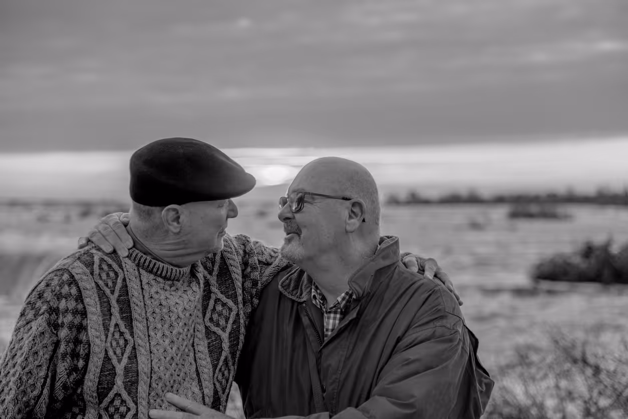 Partners gazing at each other at sunset