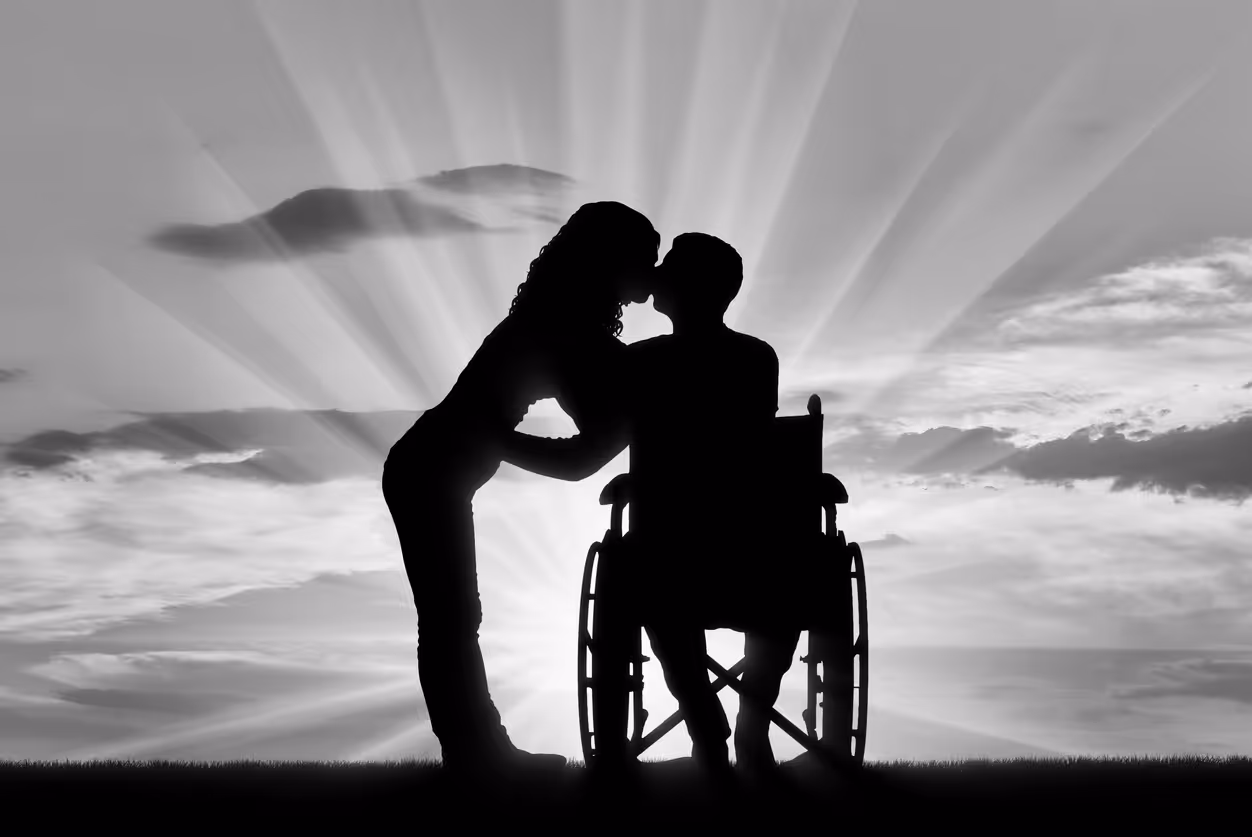 A couple kissing at sunset