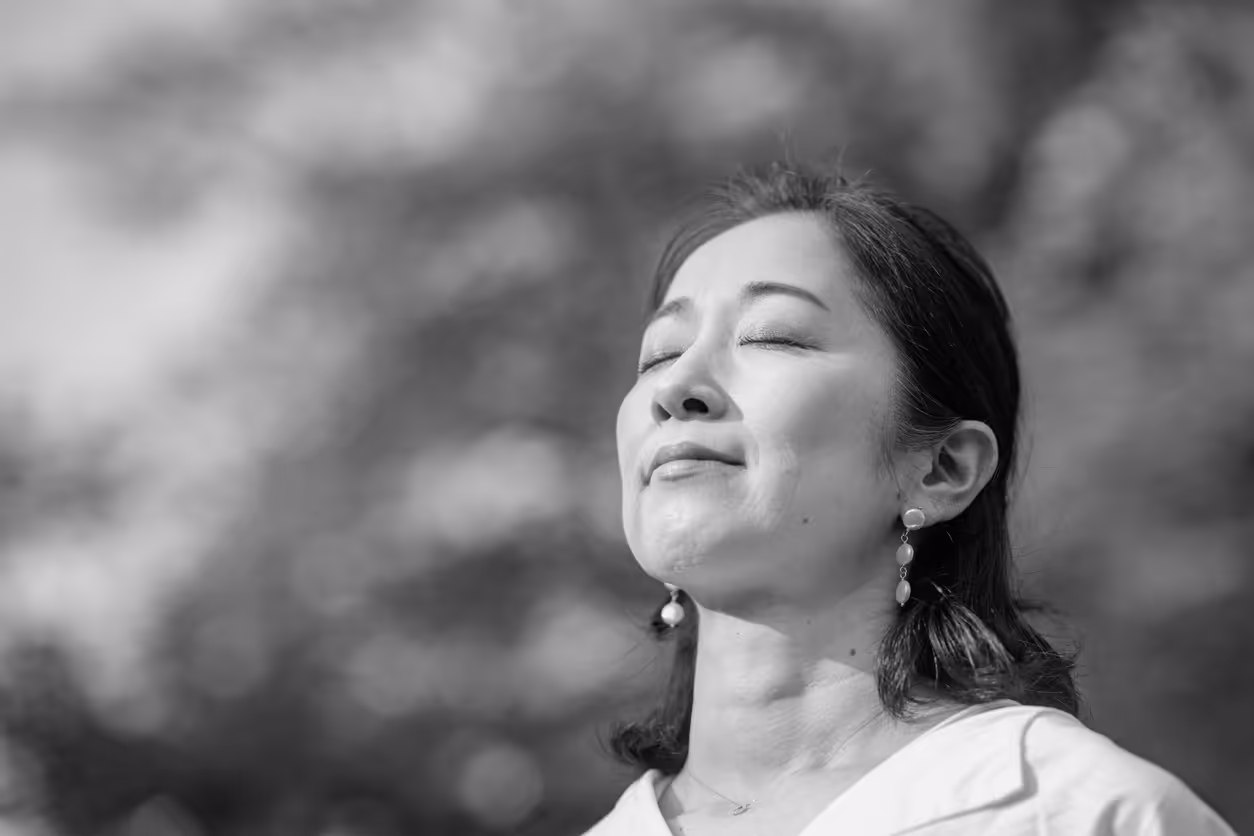 Portrait of person with eyes closed in nature