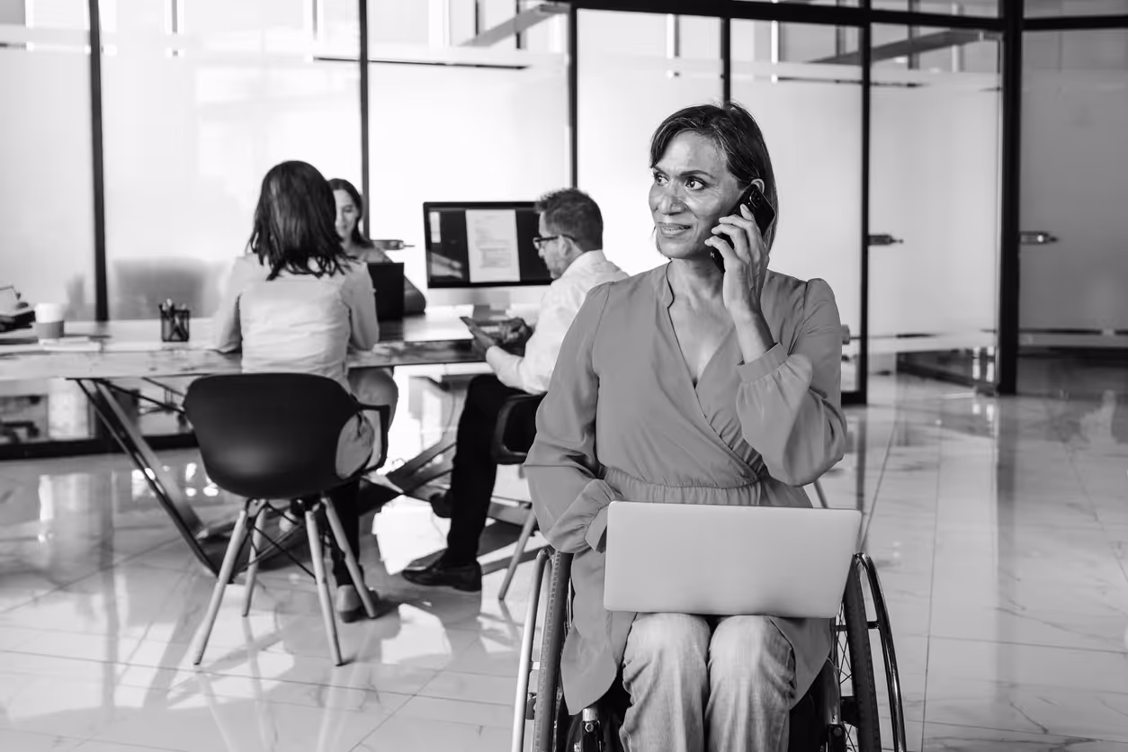 Hispanic transgender woman in a wheelchair at work