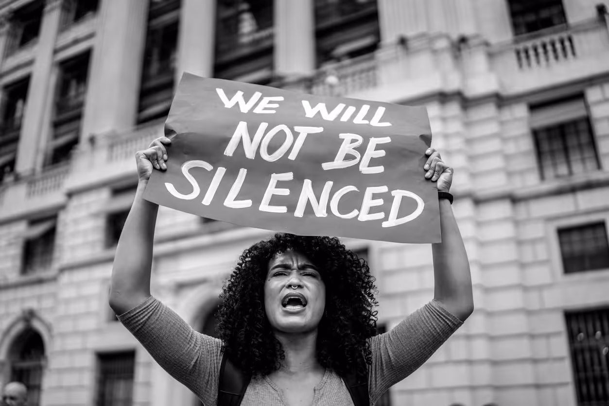 Activist holds up sign