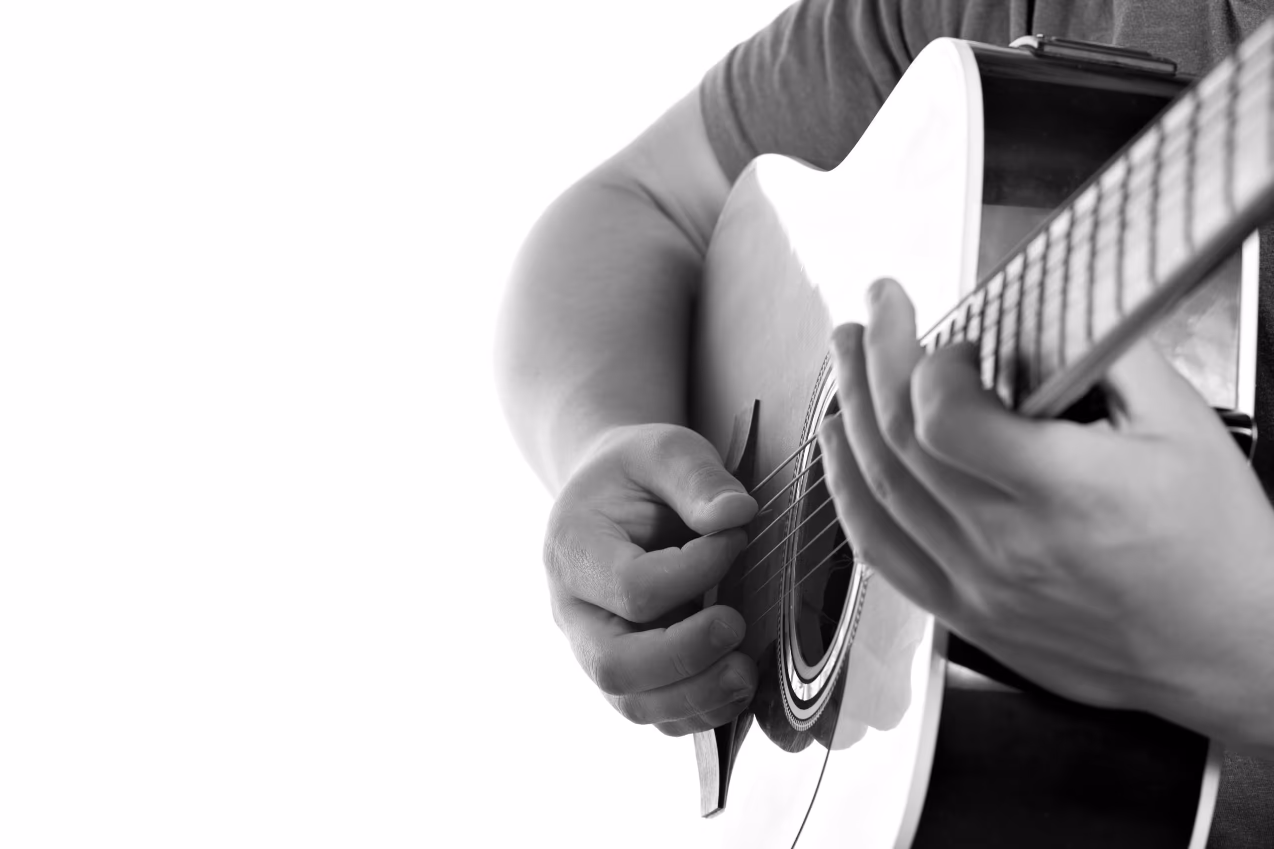 Musician playing guitar during a music therapy session