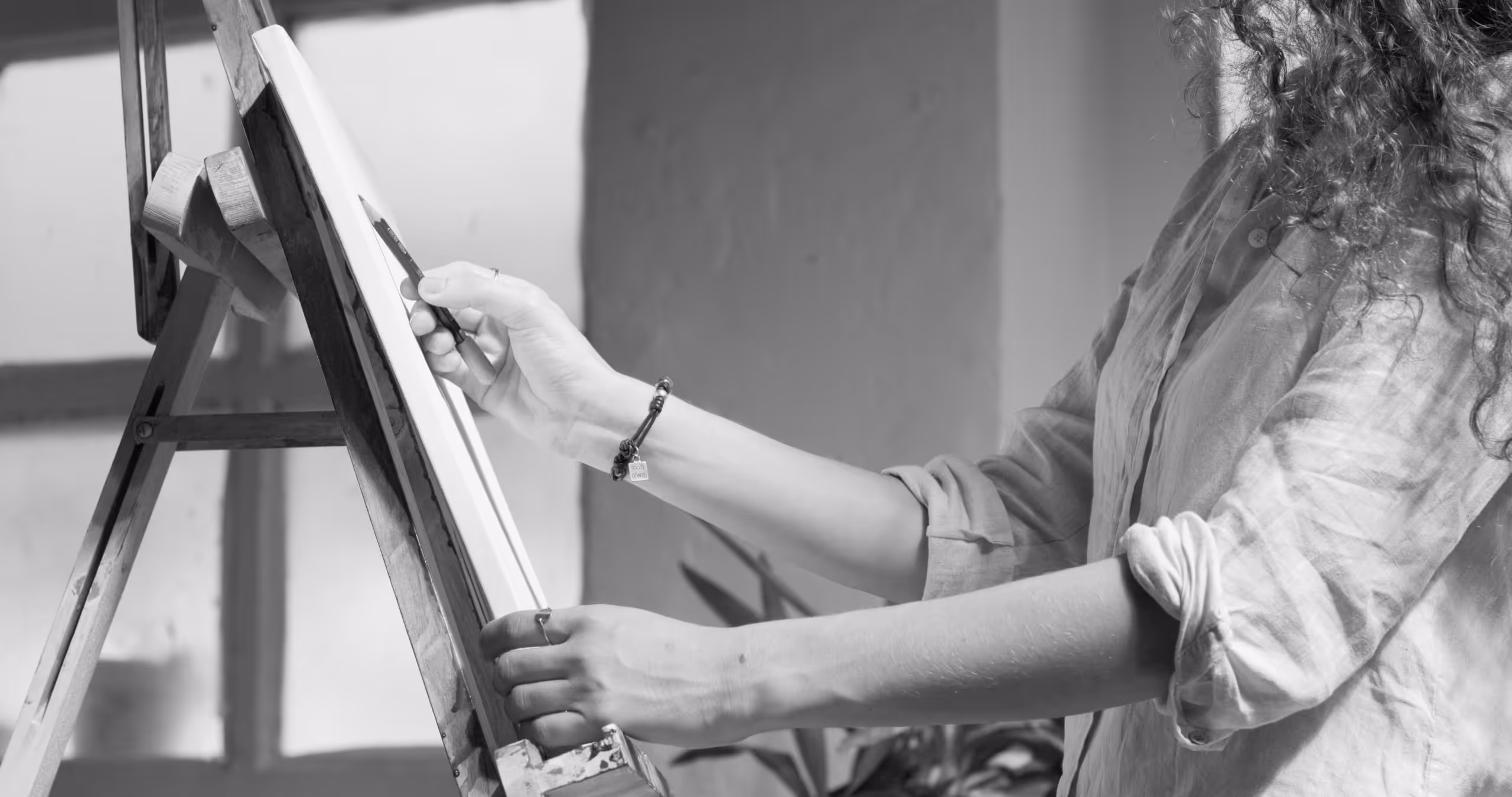 Person drawing as they explore gender identity using art therapy